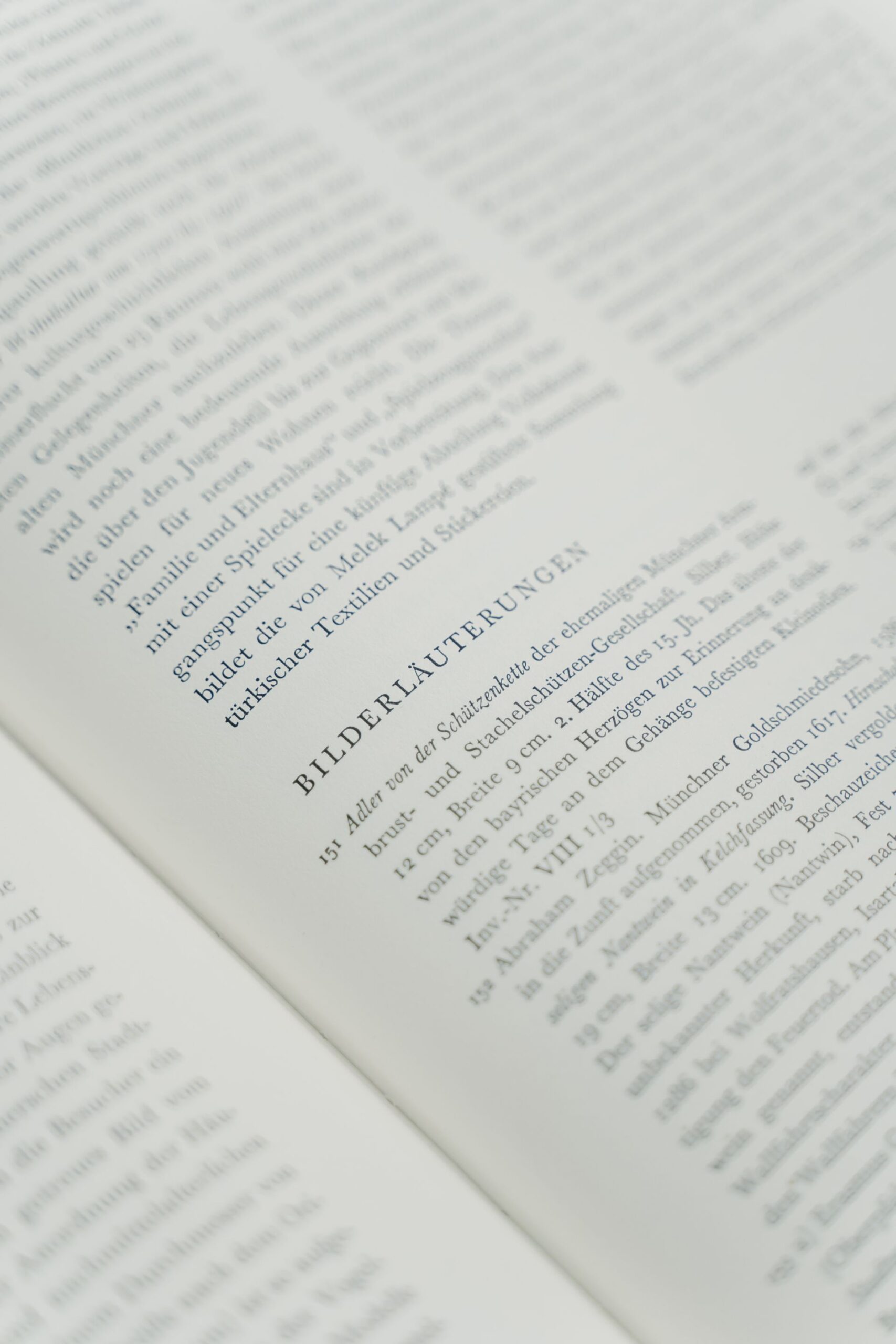 Close-up of an open book page with text in focus