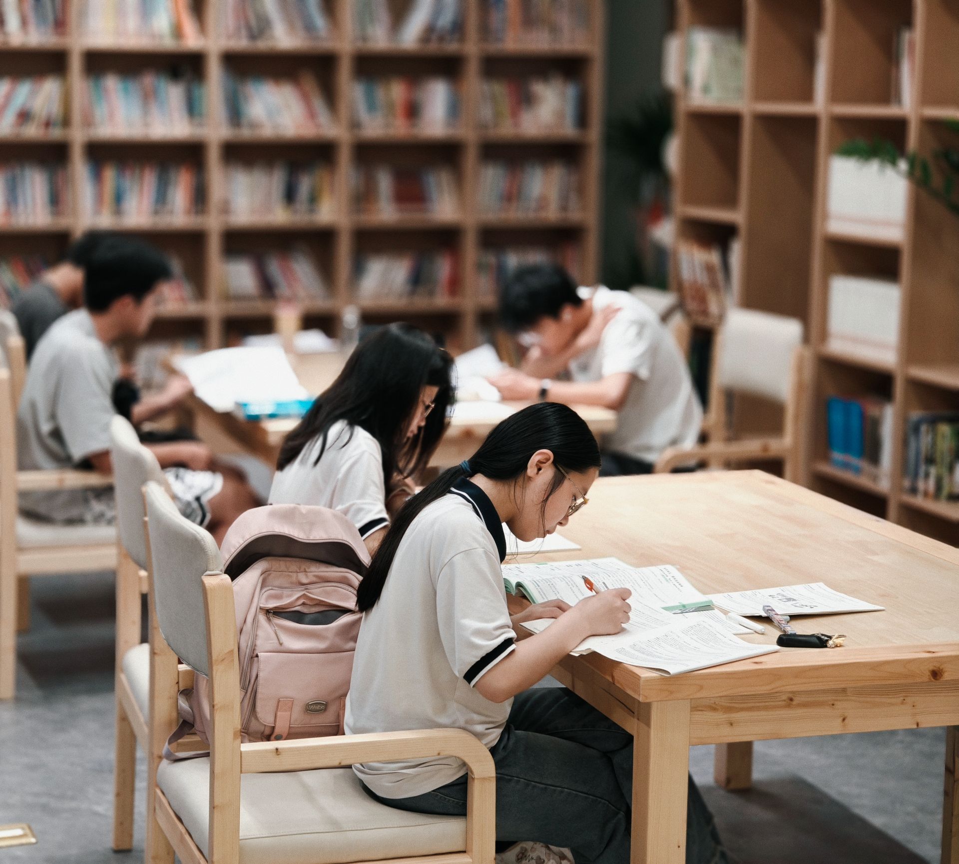 Group of students studying together in a library