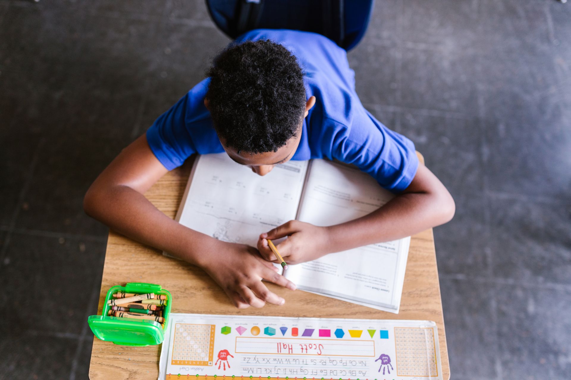 Overhead view of a student studying in a classroom