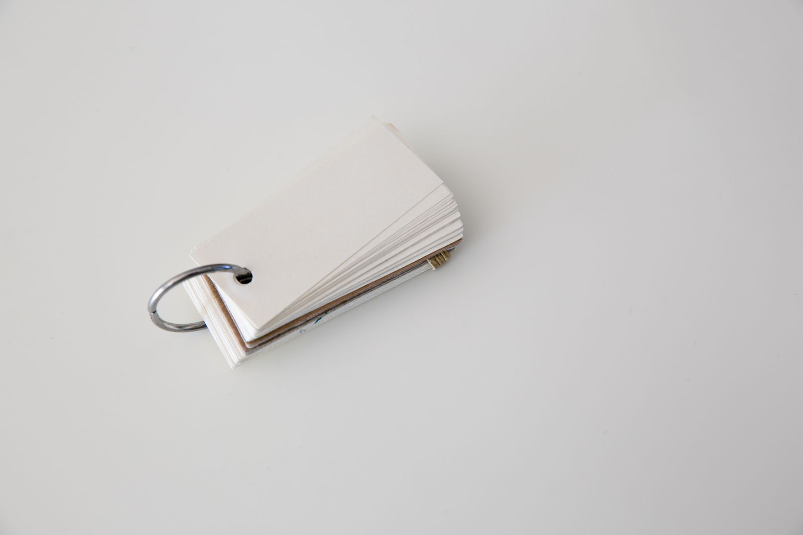 Blank sticky notes hanging on a hook