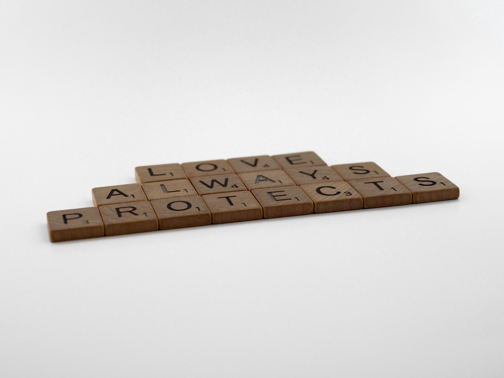 Pile of wooden Scrabble pieces on a table