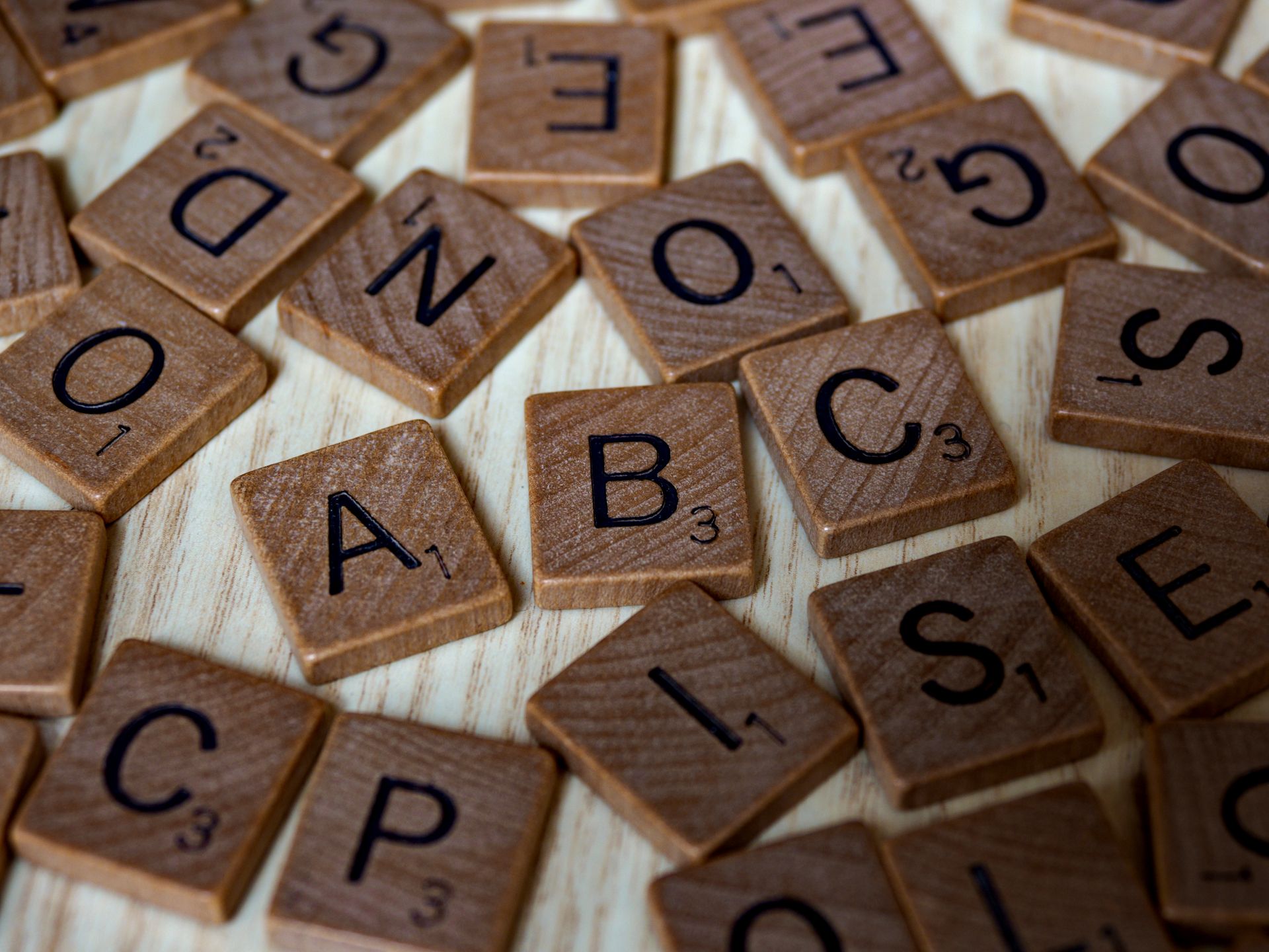 Close-up of brown wooden letter blocks