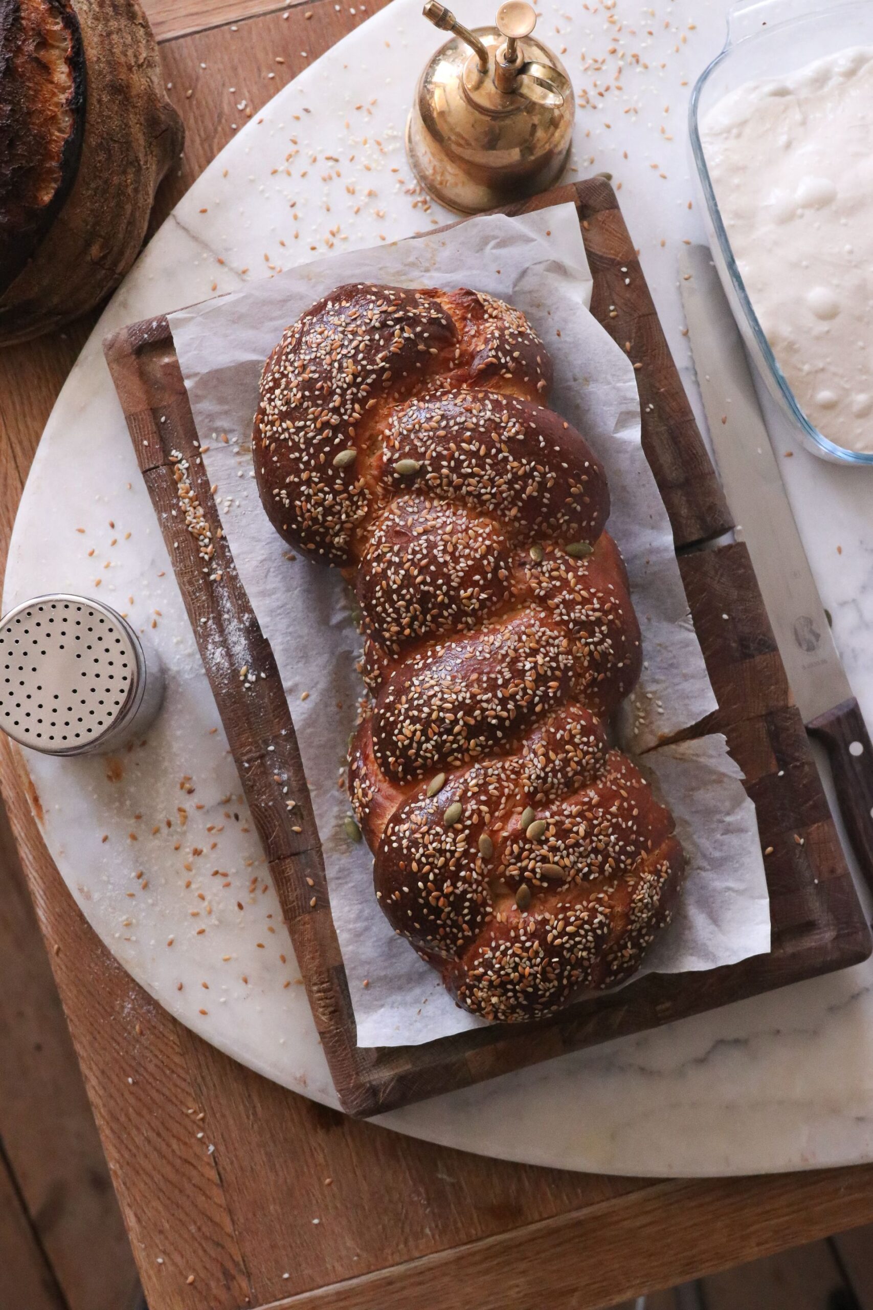 Freshly baked brown bread on a wooden tray