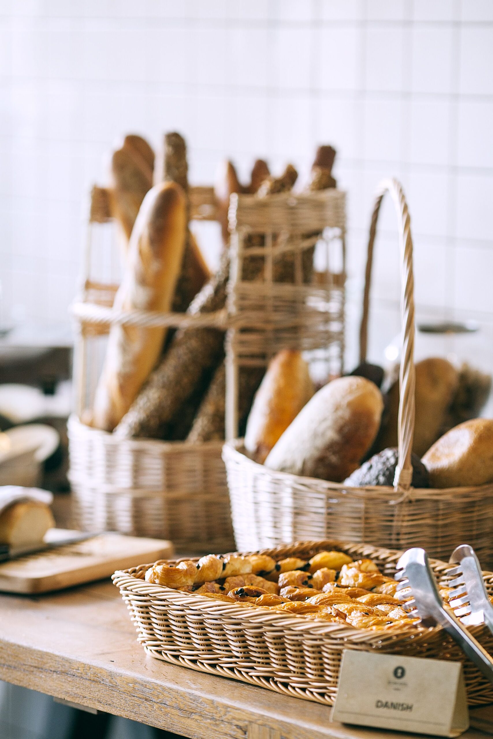 Fresh bread and buns displayed in bakery baskets