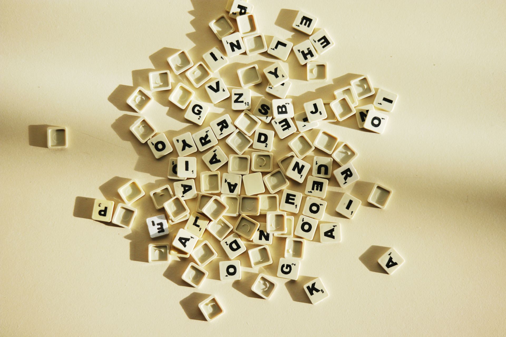 White Scrabble tiles on a white background