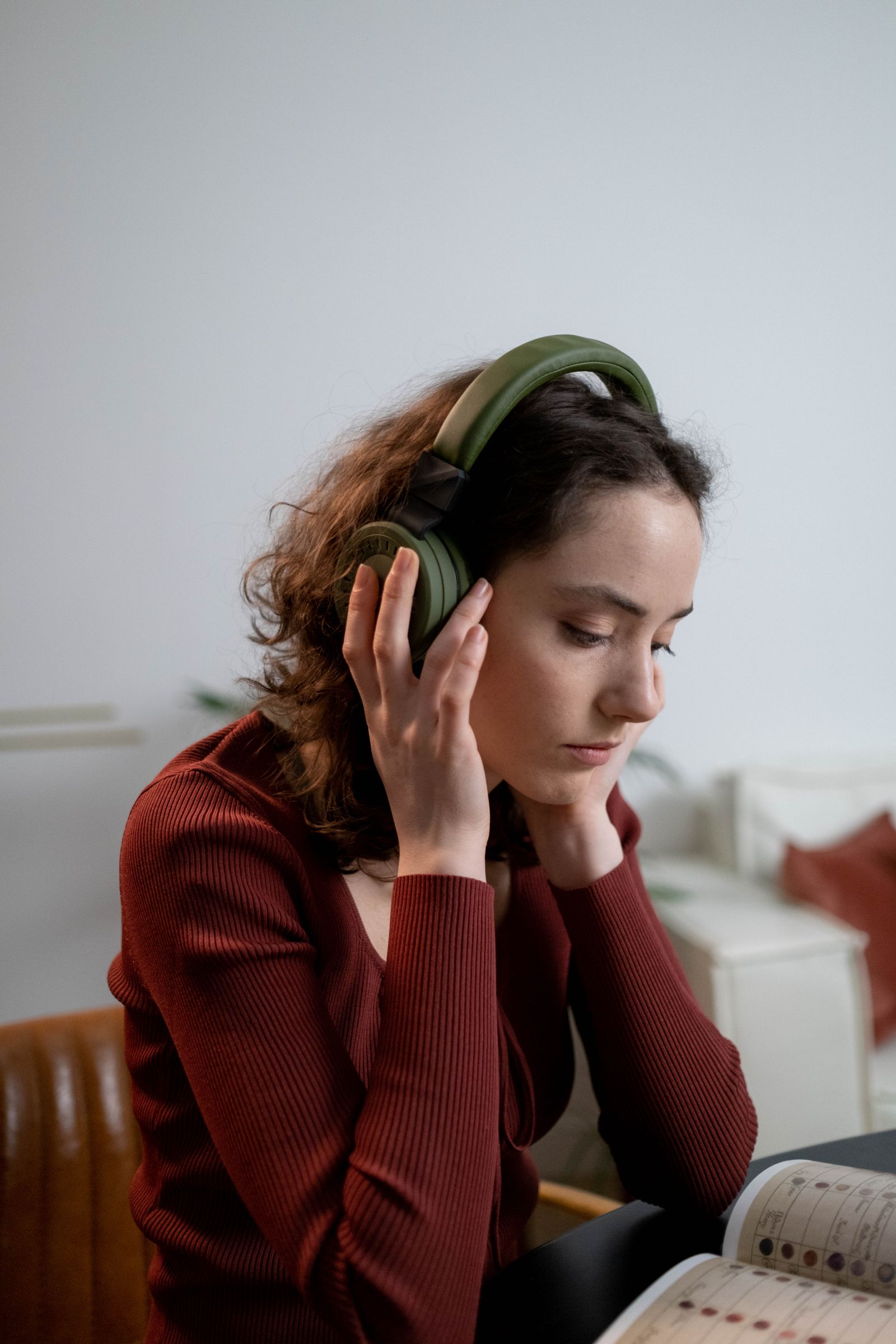 Woman wearing headphones learning a language