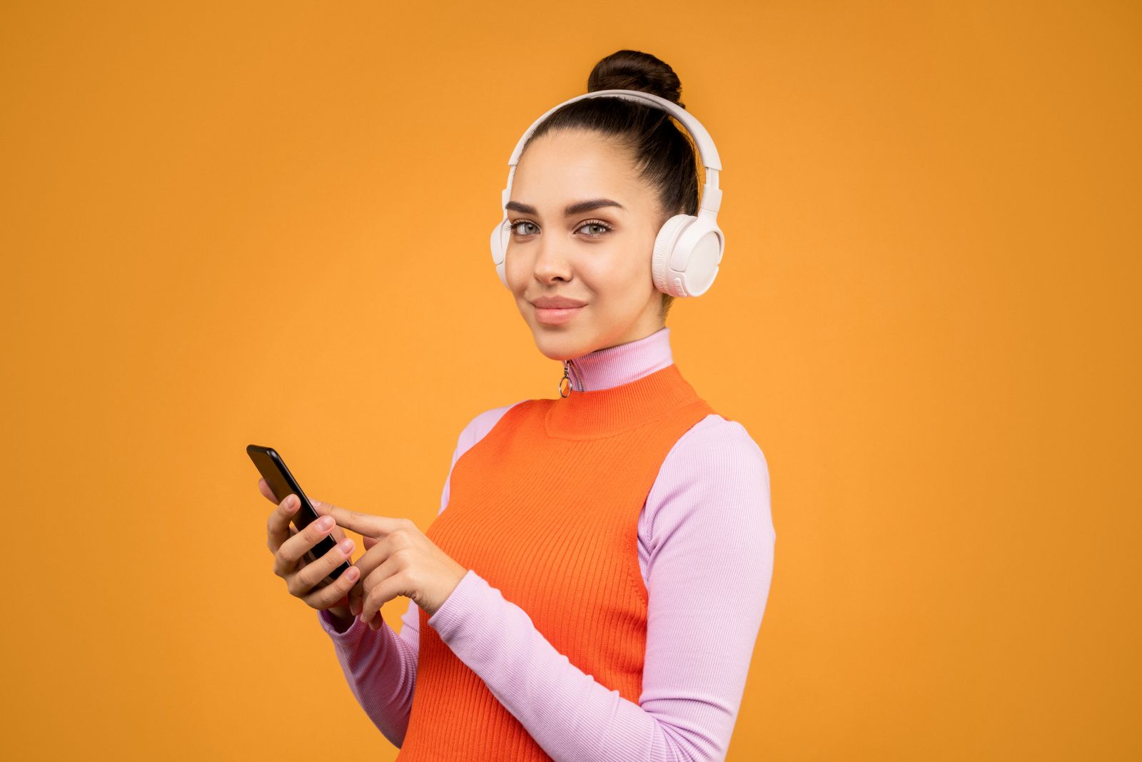 Woman wearing headphones learning a language