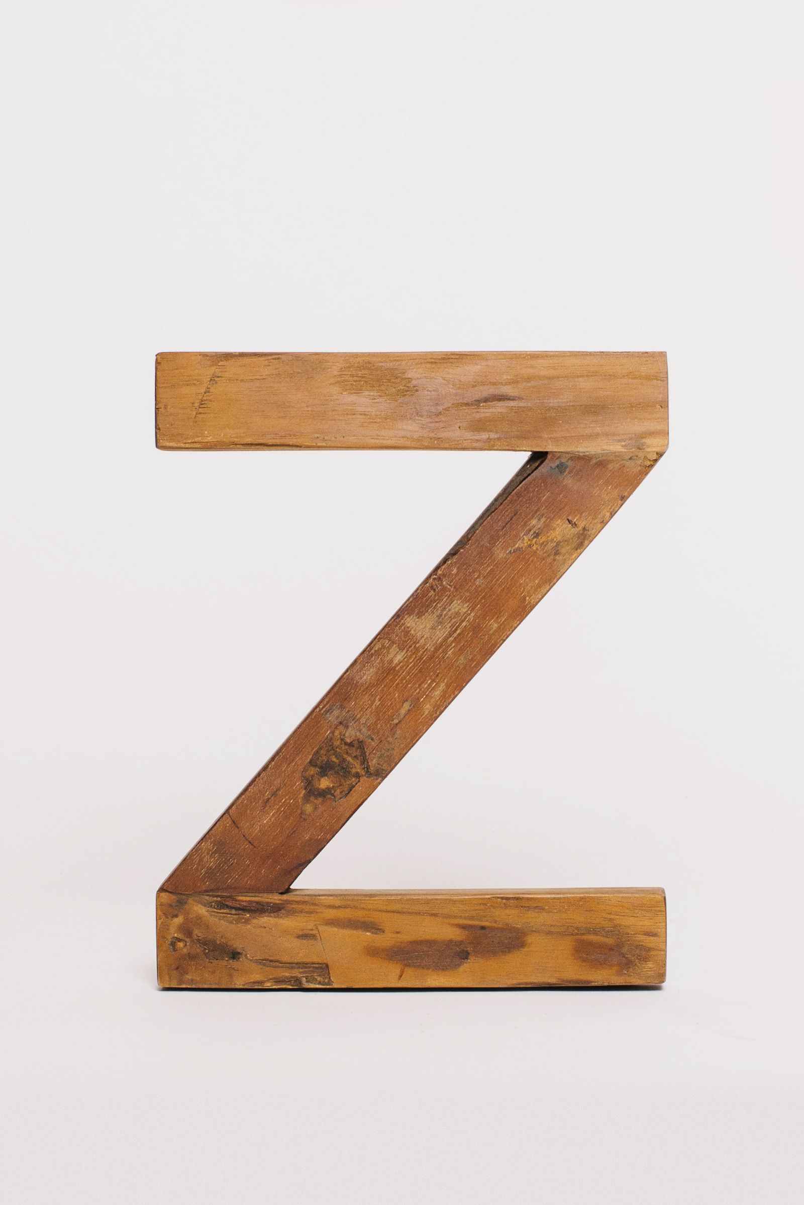 Wooden block letter on white background