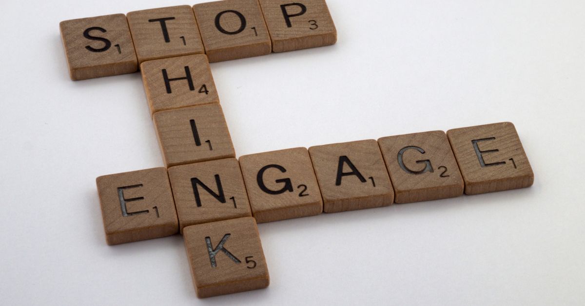 Scrabble tiles spelling strategic words on white