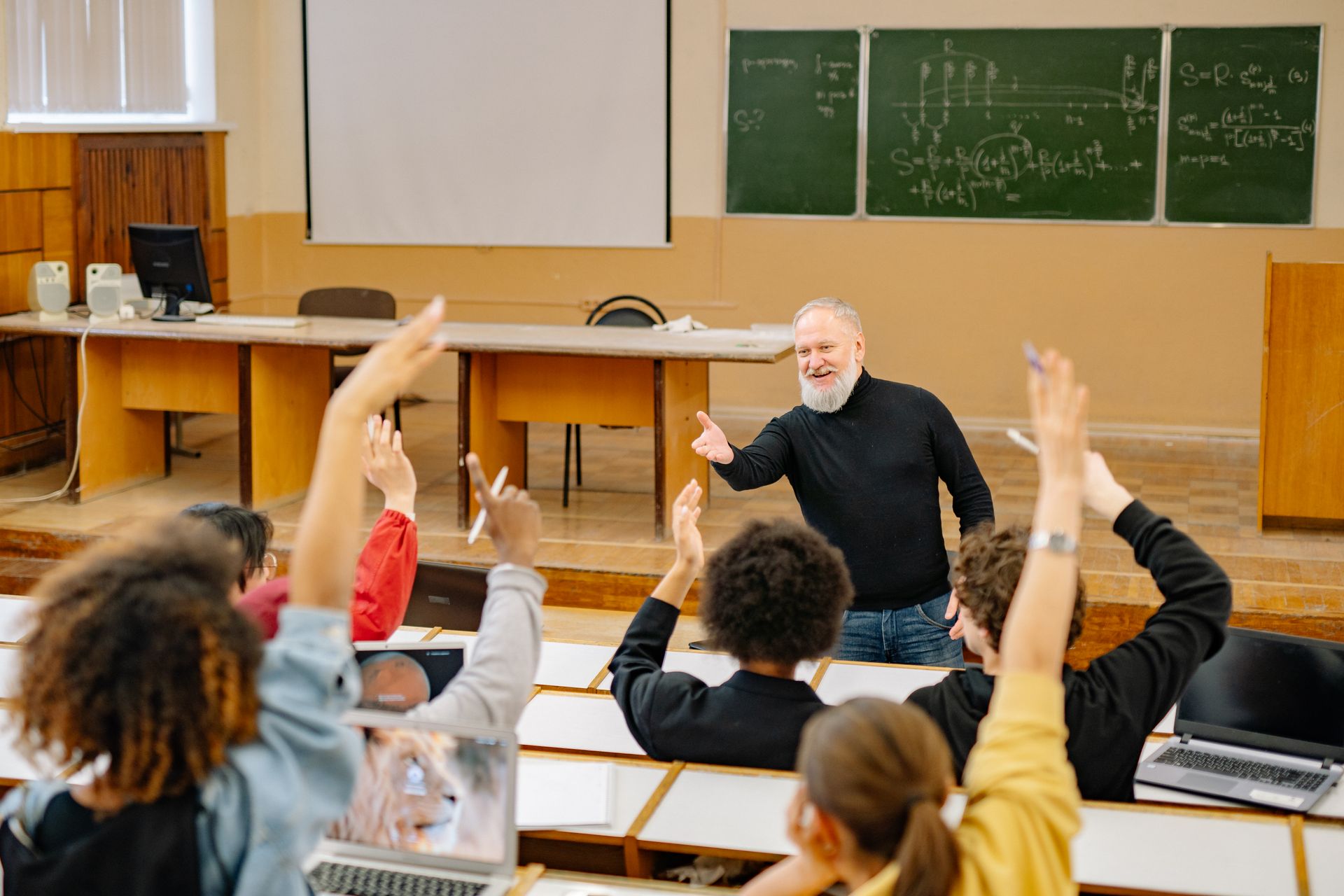 Professor engaging students in a lively classroom discussion