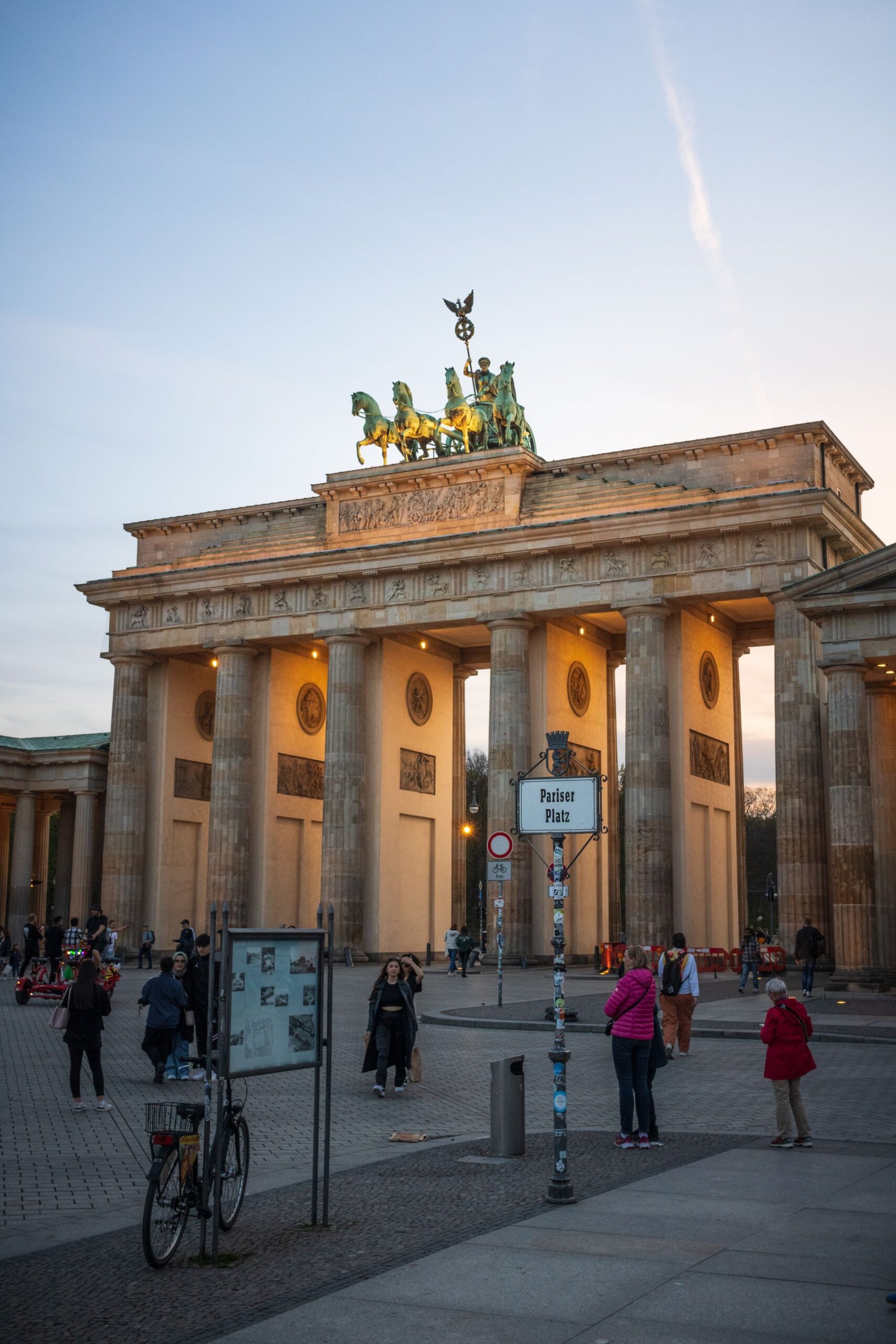 Brandenburg Gate illuminated at sunset in Berlin