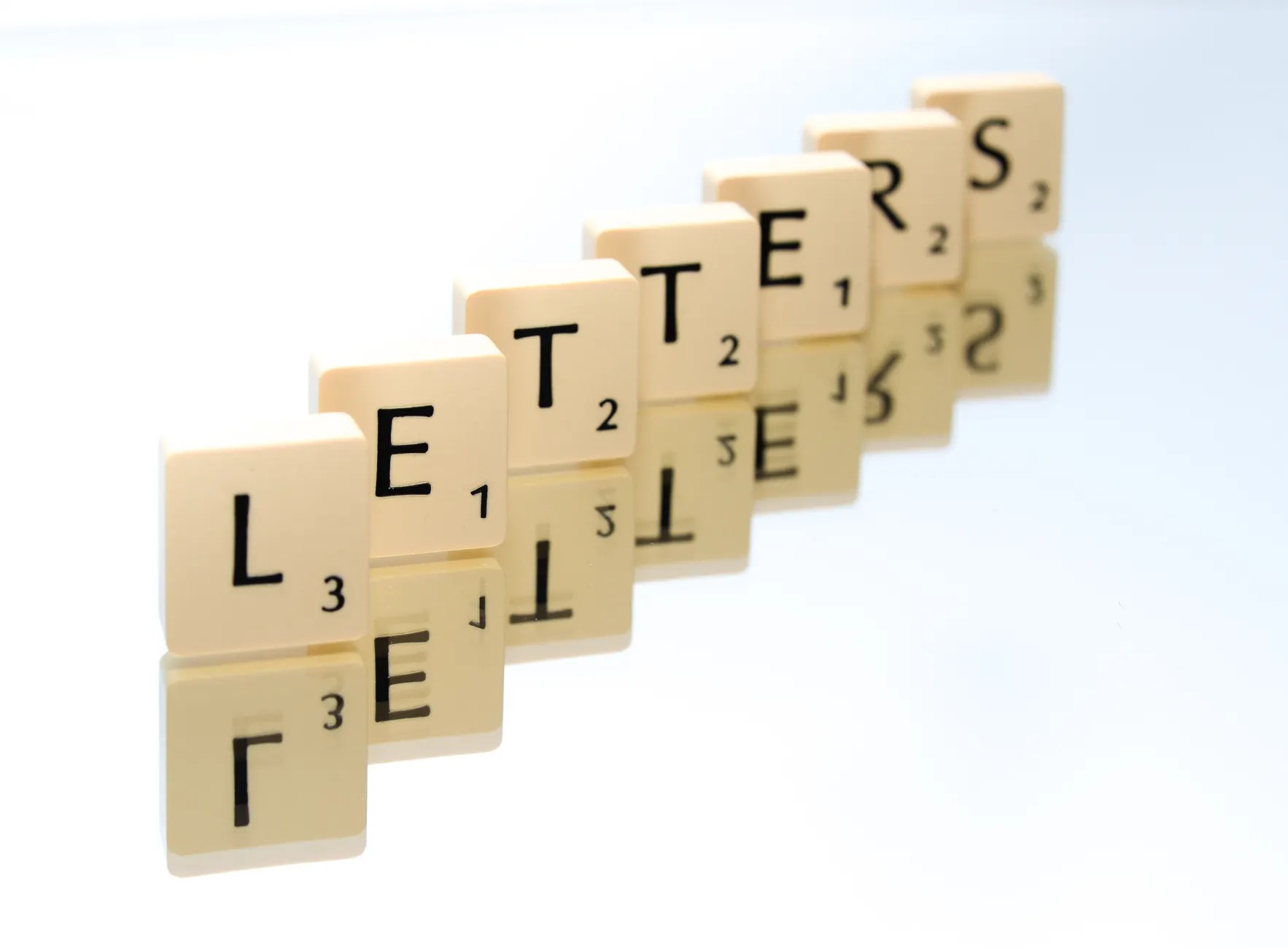 Scrabble tiles arranged to spell words and text