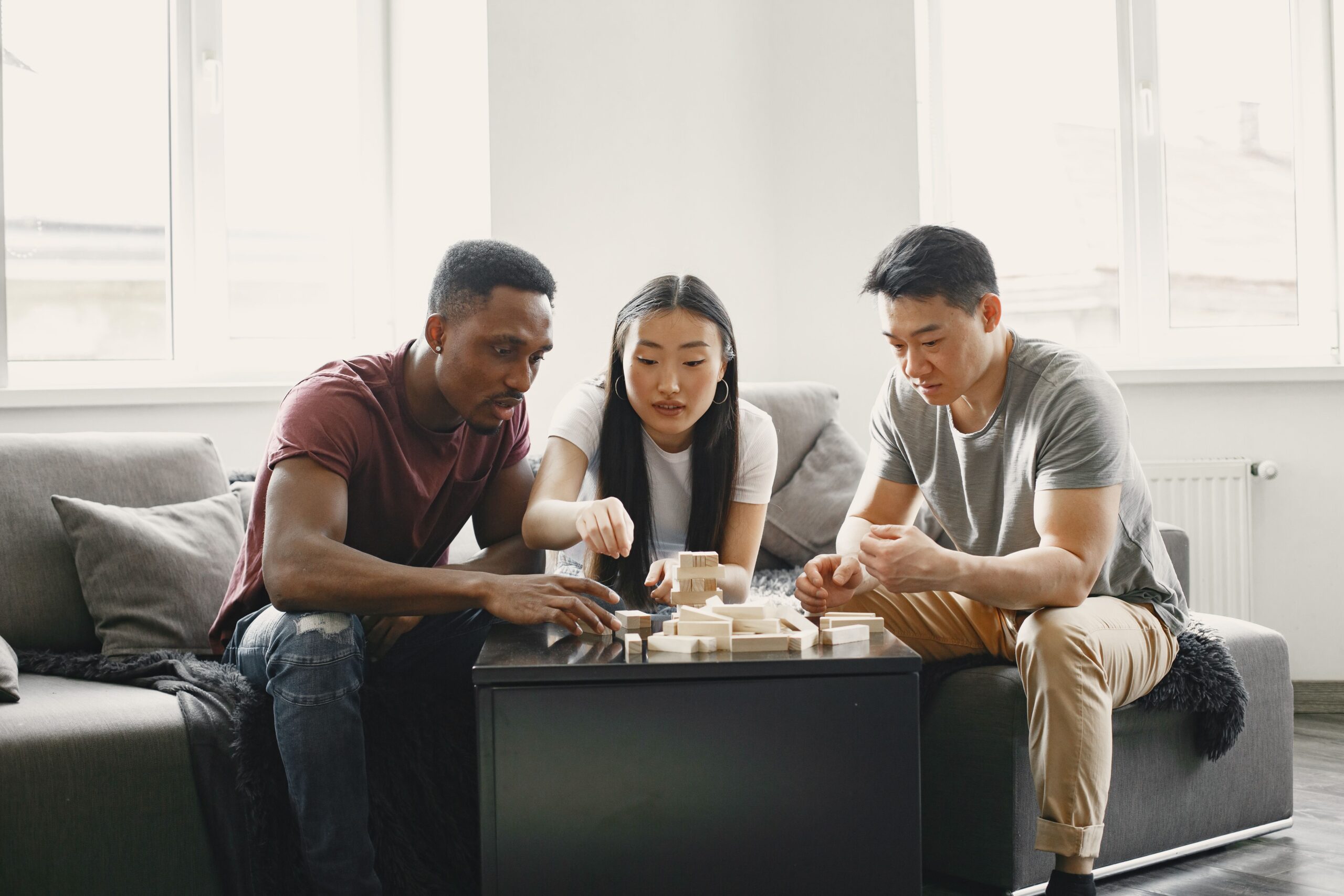 People playing a game together while sitting on a couch