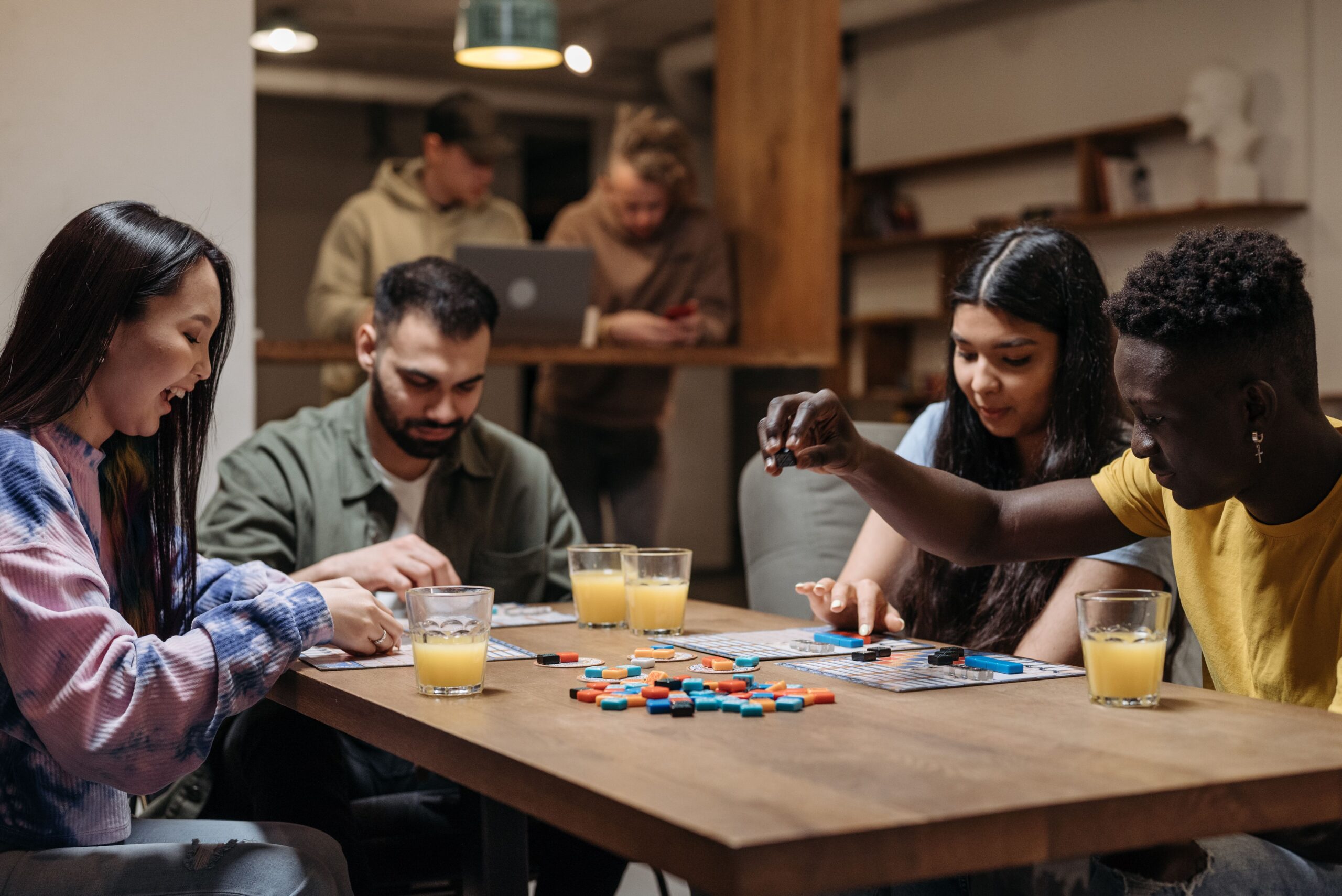 A group of people playing a board game