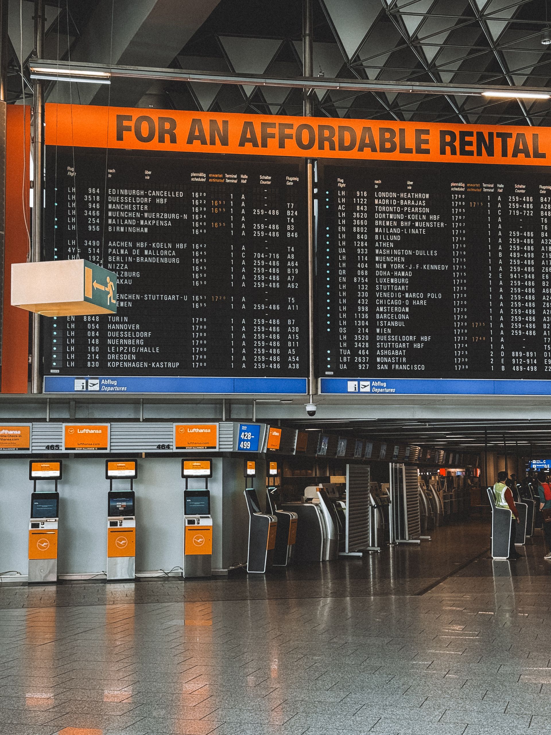 Departure hall at Frankfurt Airport with flight information board