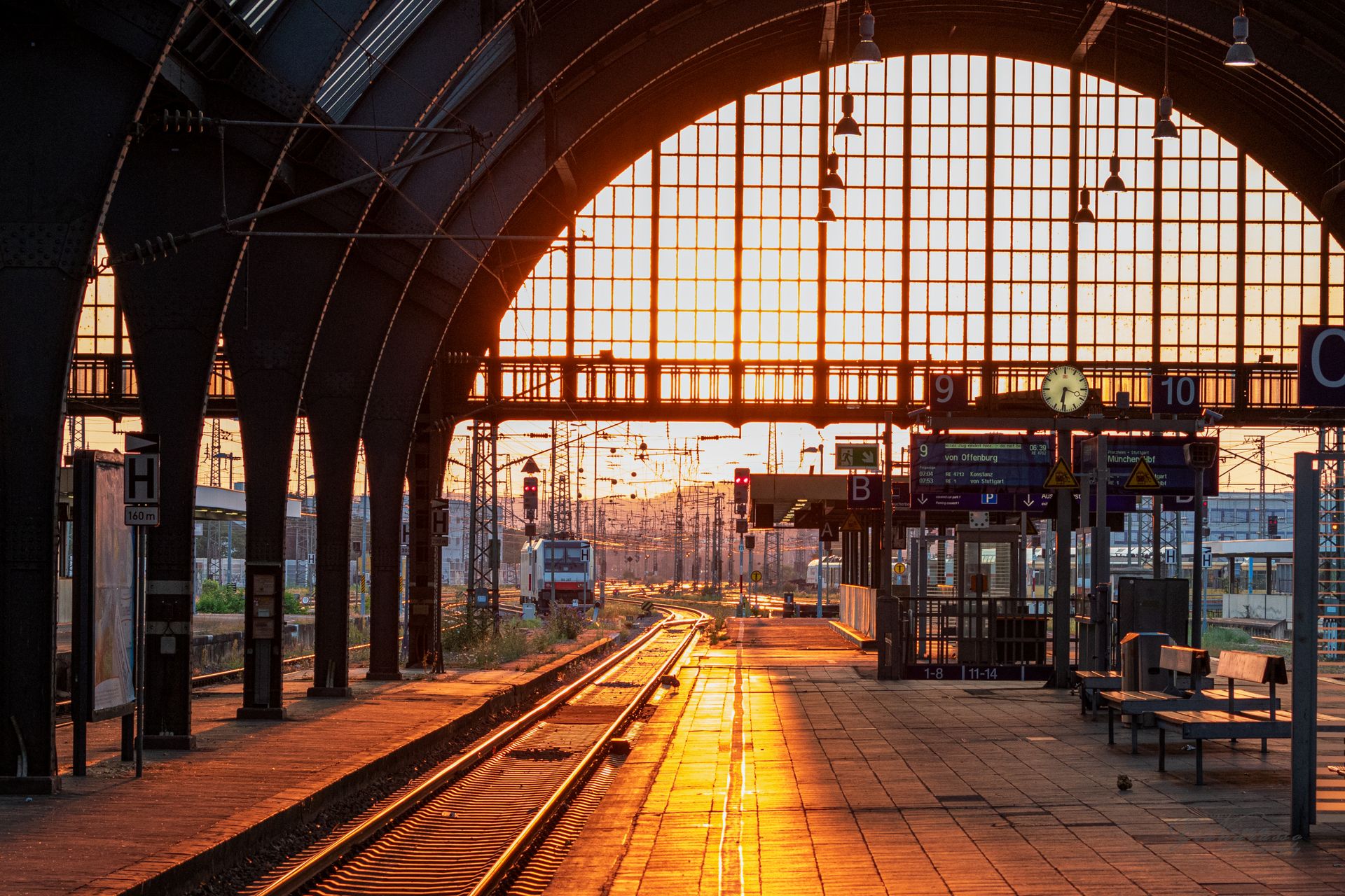 Railway tracks glowing at sunset at Karlsruhe station