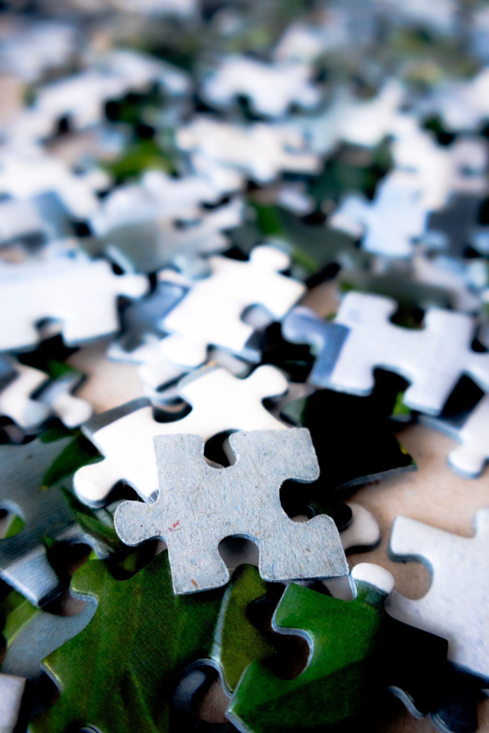 Detailed image of scattered puzzle pieces, showcasing vibrant colors and textures.