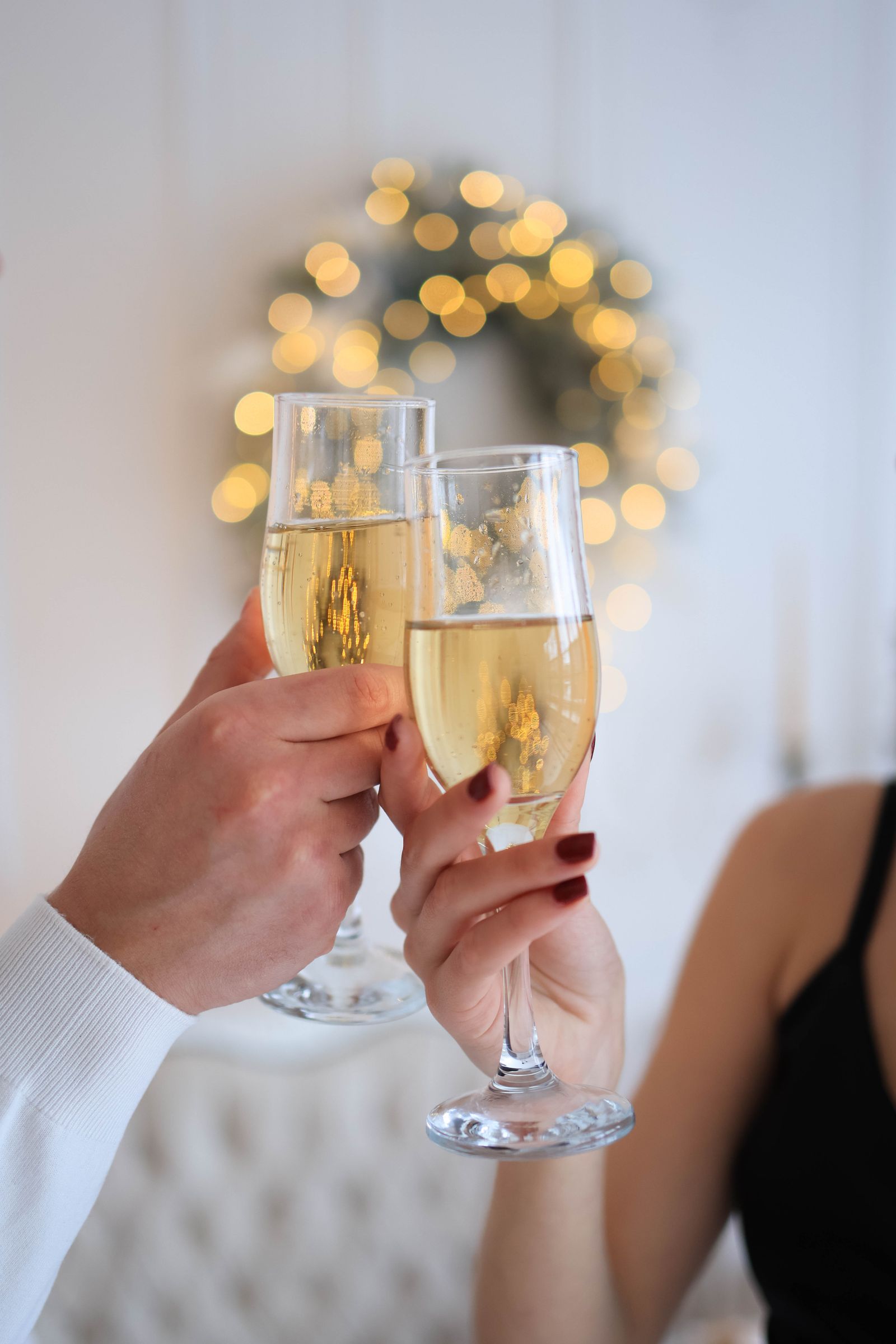 Champagne glasses raised in a birthday toast