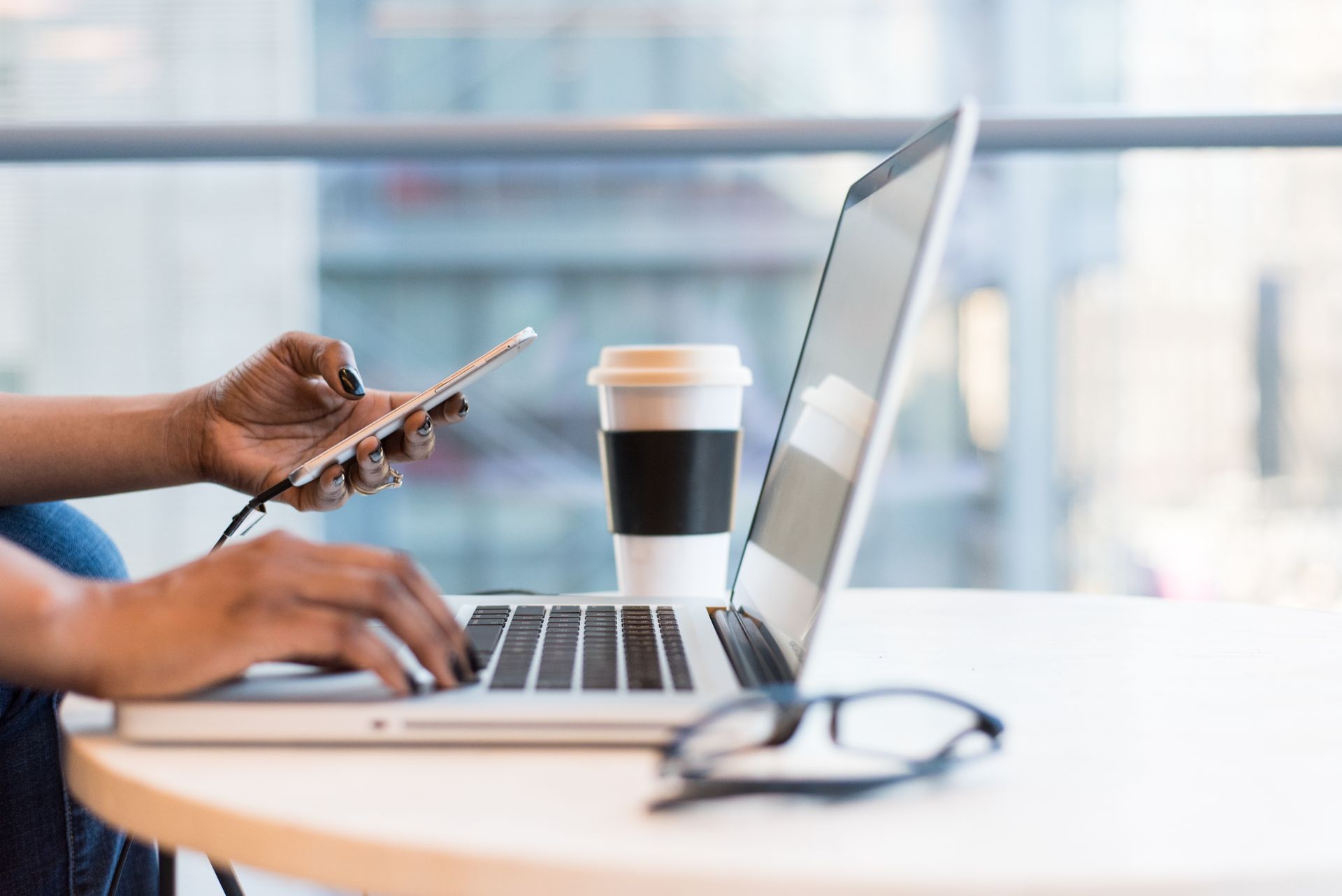 Laptop on a desk in a bright office