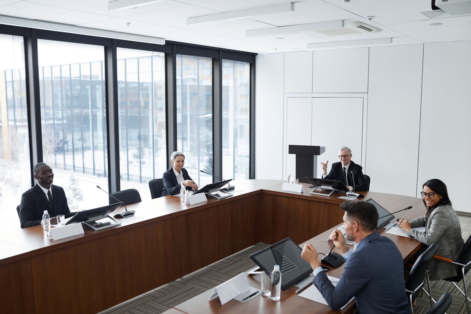 Colleagues discussing around a meeting table