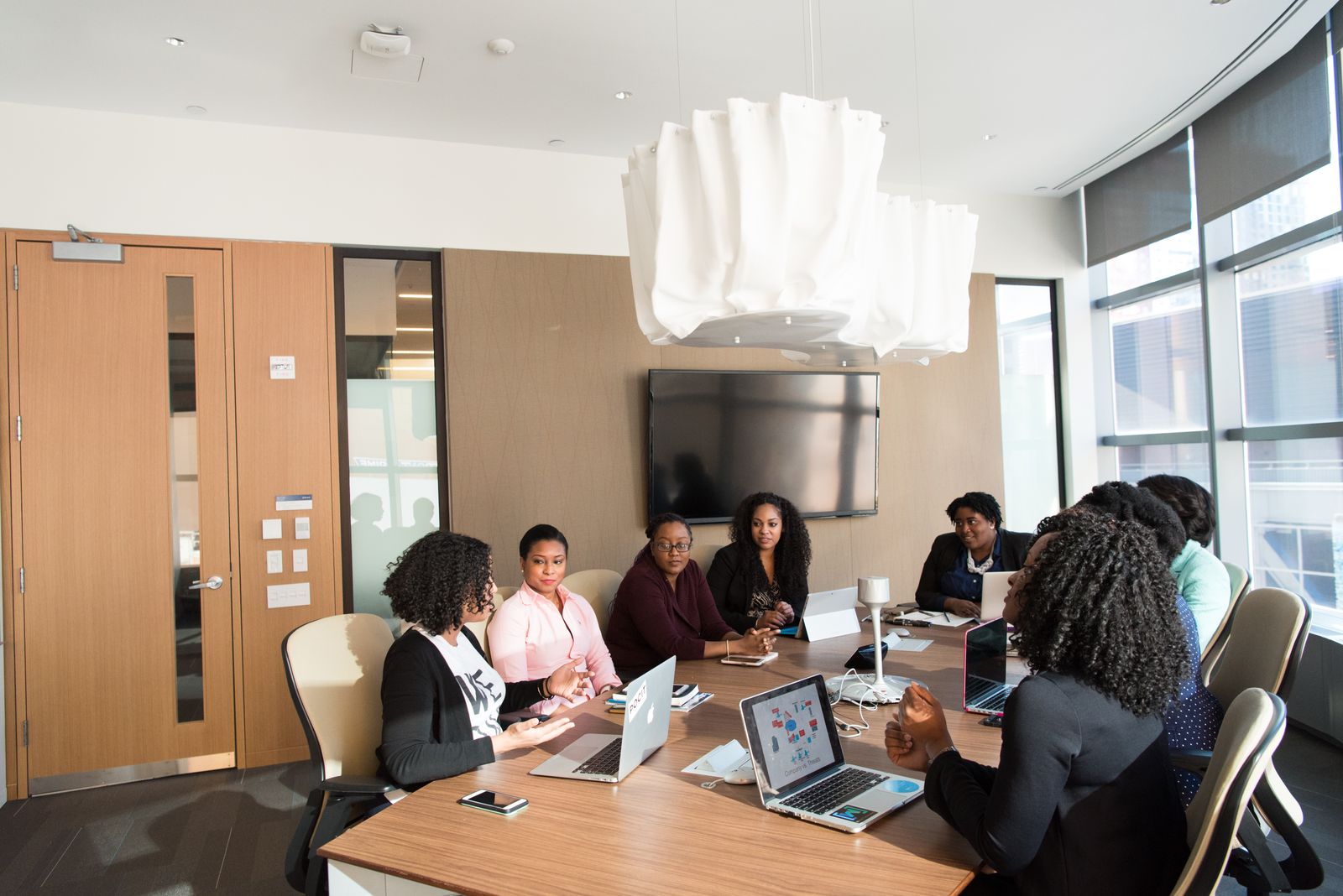 Professionals talking in a boardroom