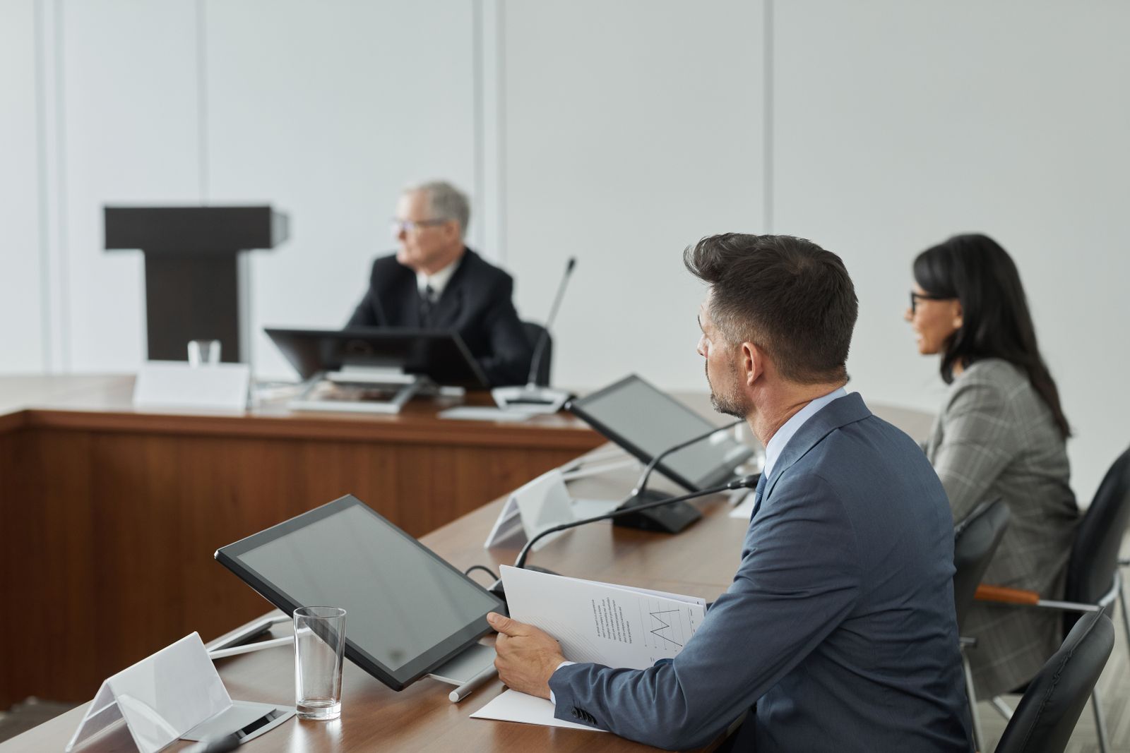 Office meeting with documents on table