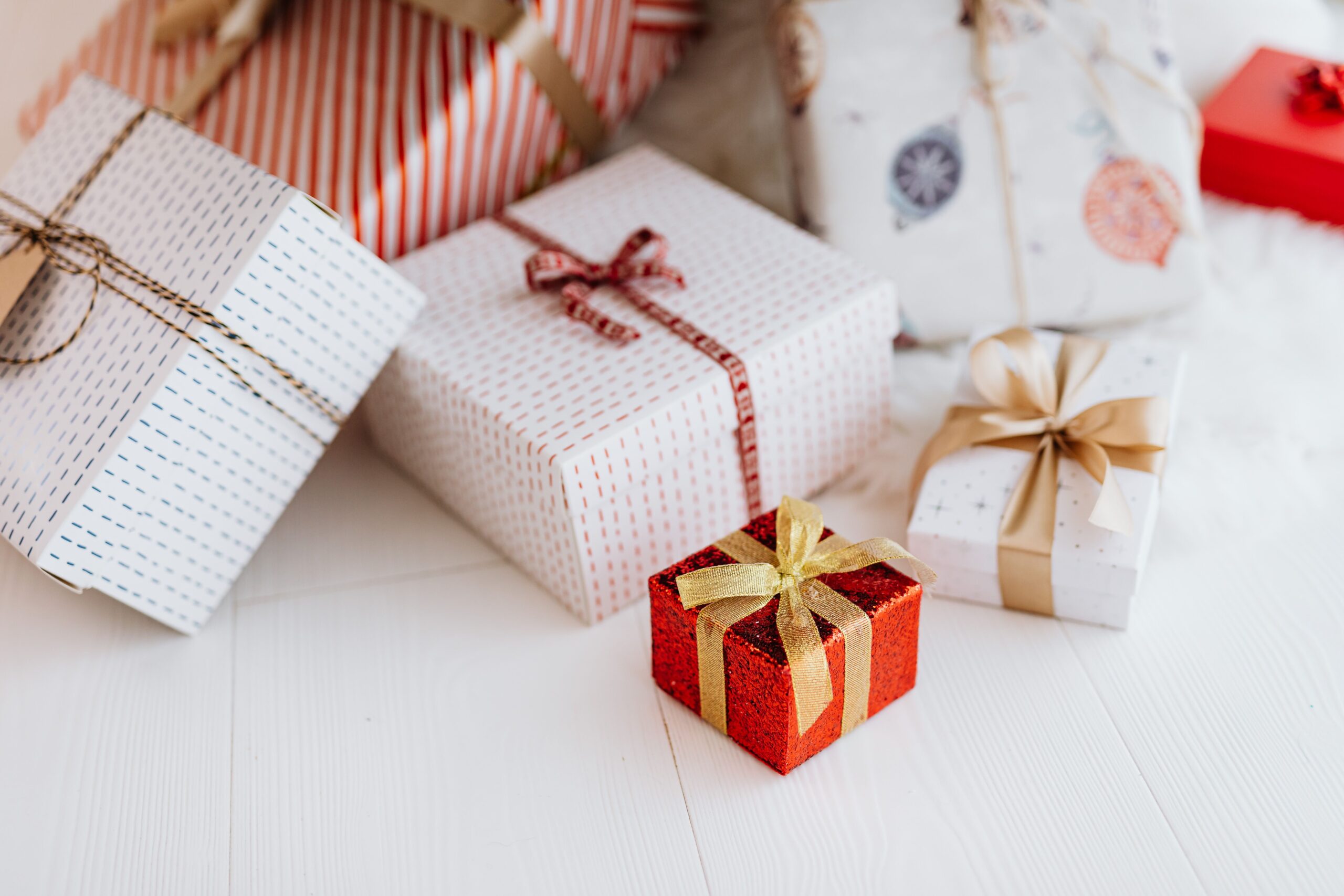 Wrapped Christmas gifts with ribbons and bows