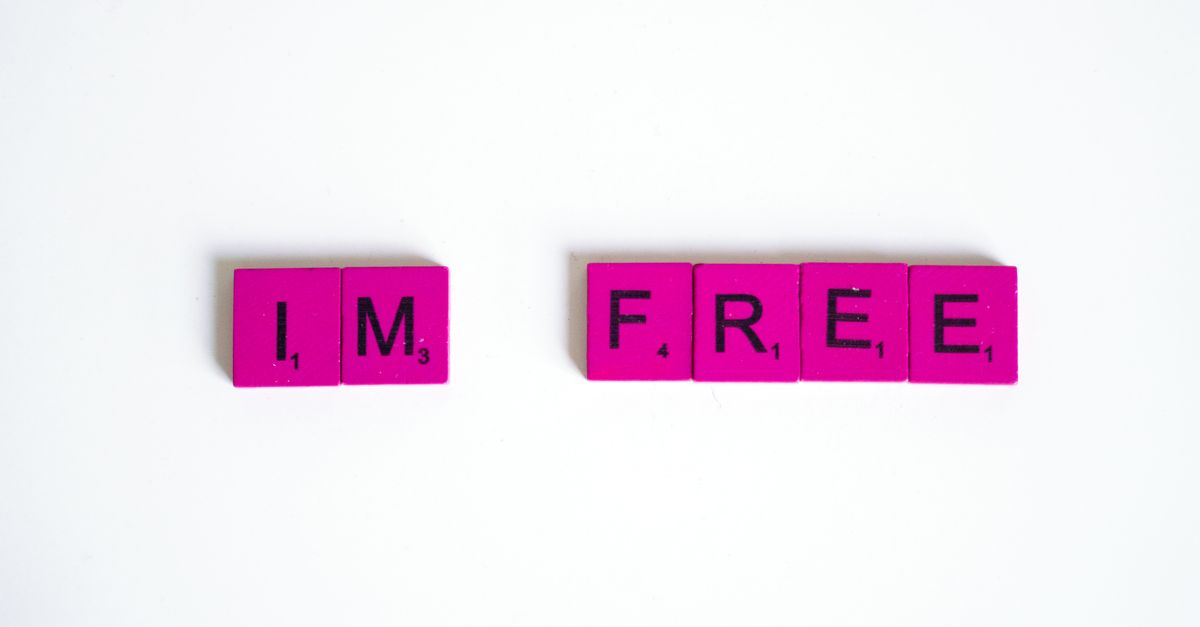 Pink and black Scrabble tiles close-up