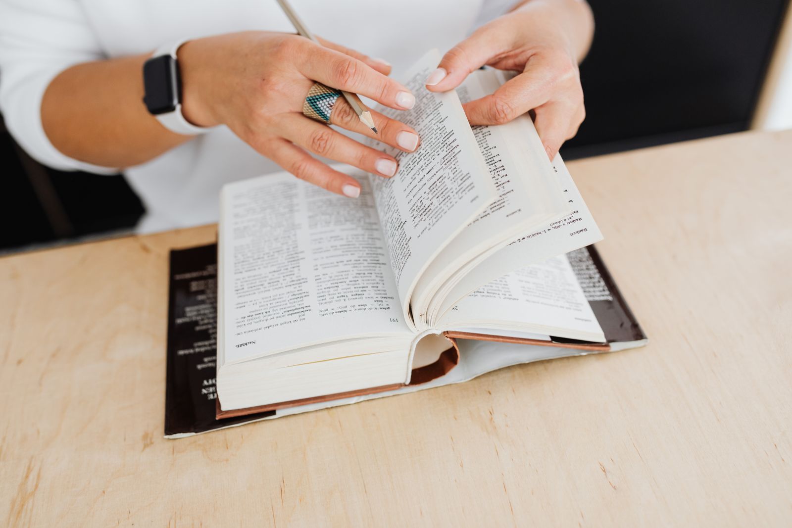 Woman flicking through the pages of a book