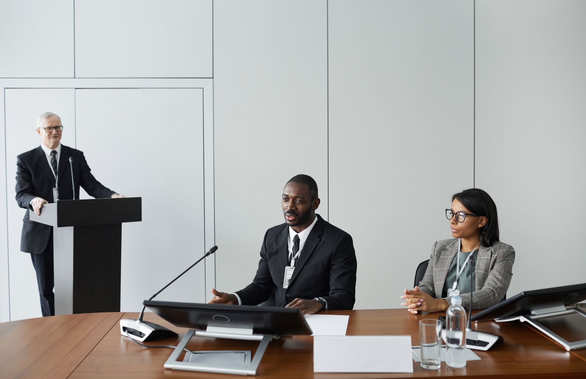 Colleagues in corporate attire at a business meeting