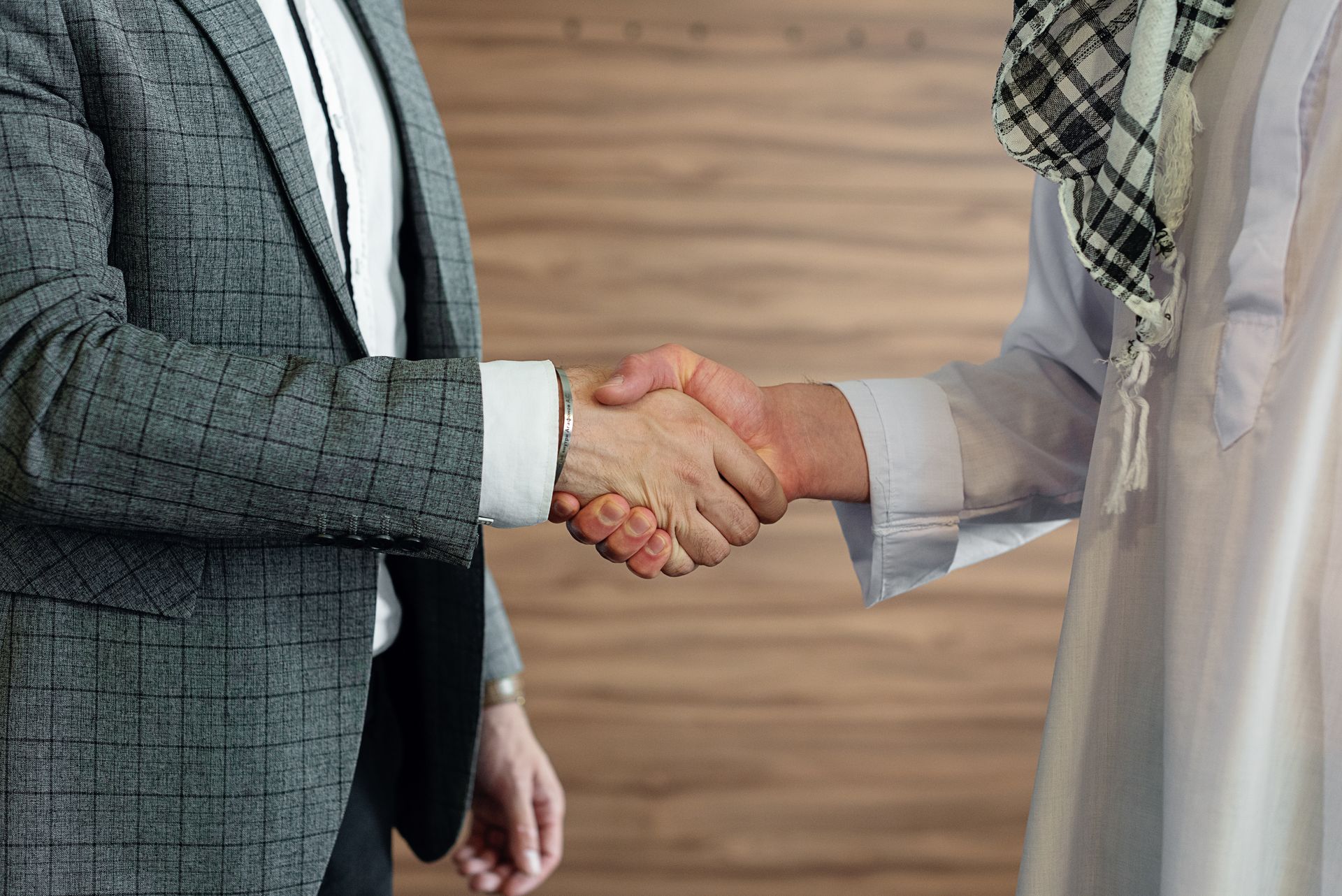 Close-up of a handshake between two businessmen