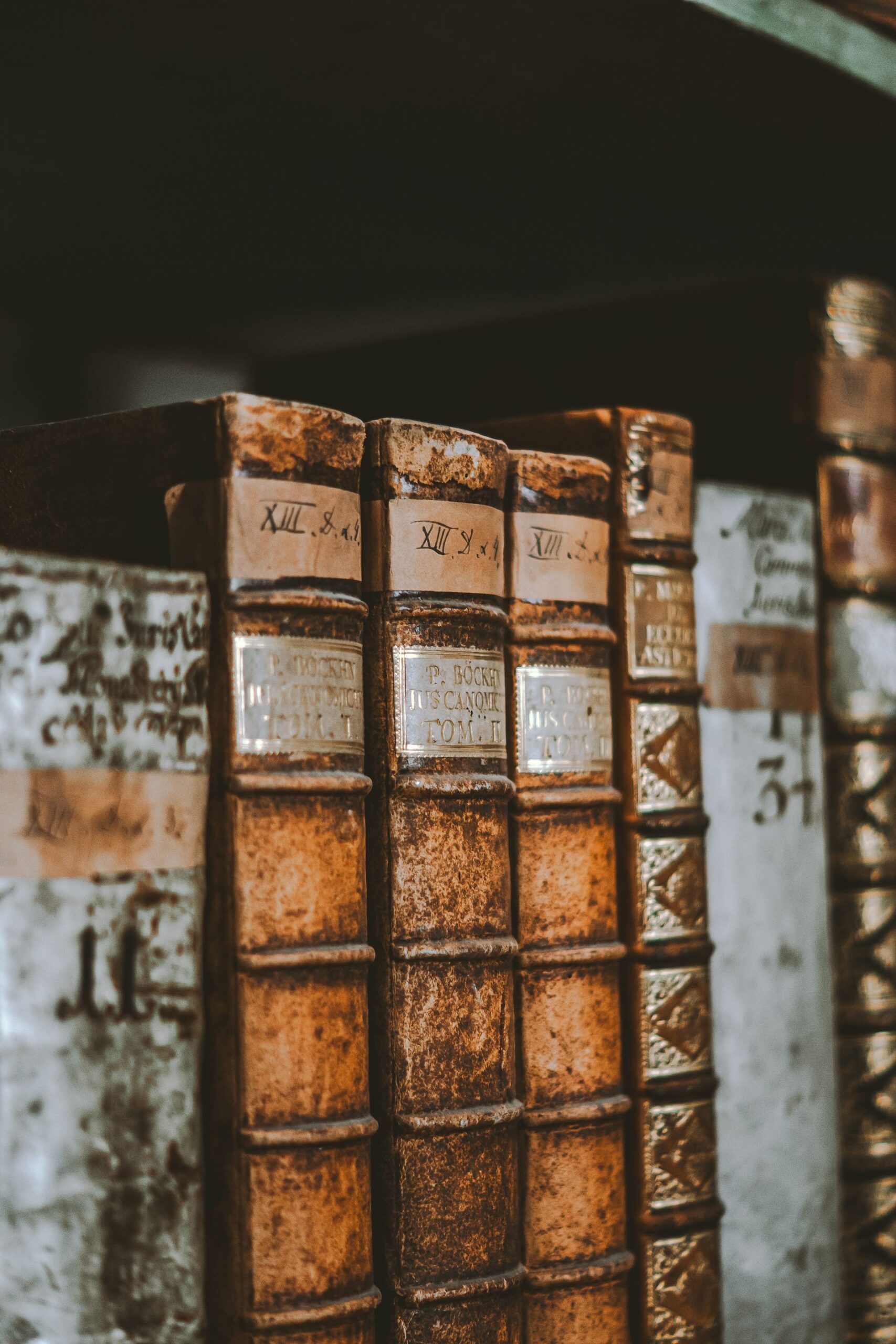 Old books on a shelf in a library