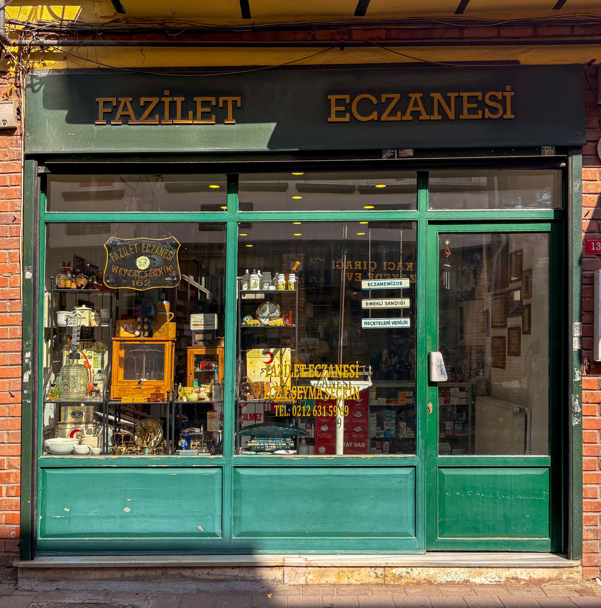 Vintage pharmacy storefront on a sunlit street