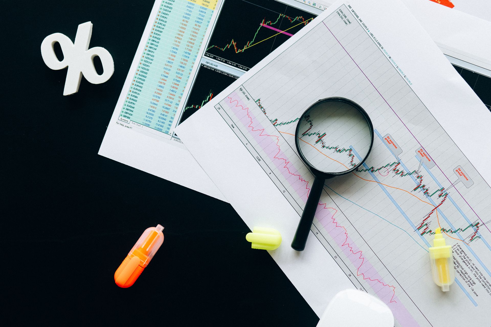 Magnifying glass over documents, inspecting details