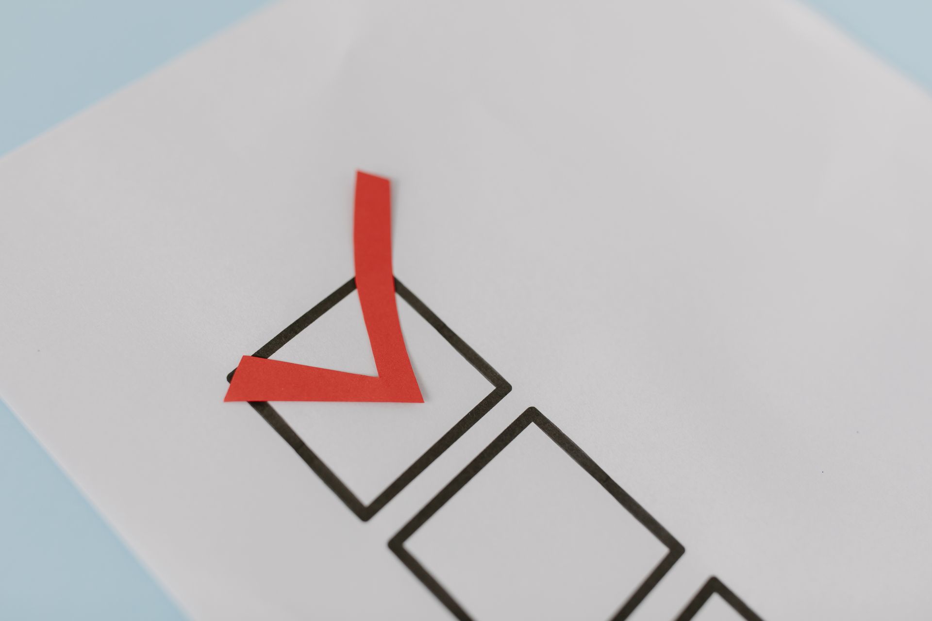 Red check mark in a box symbolizing a correct choice