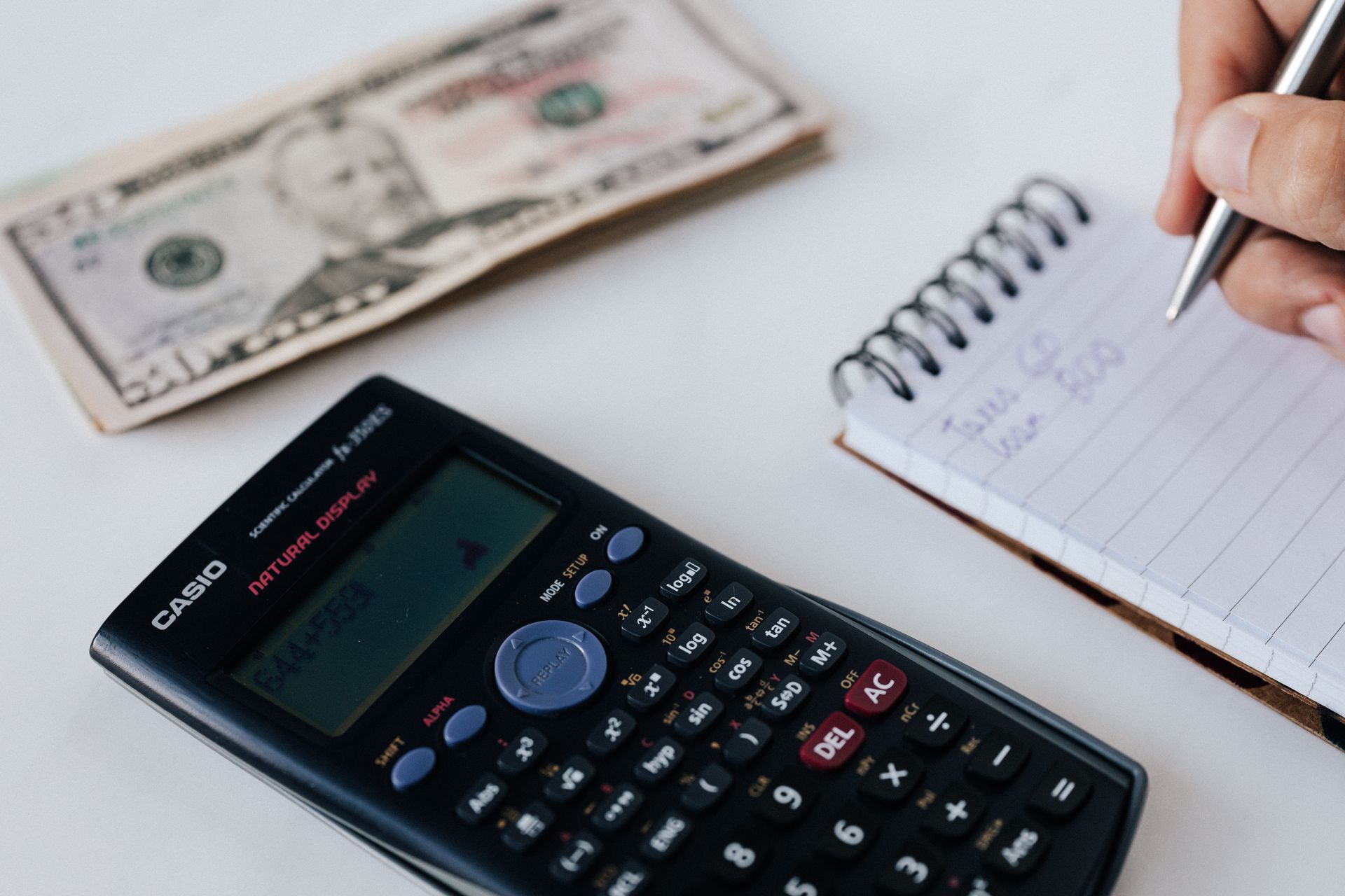 Calculator and financial paperwork on desk