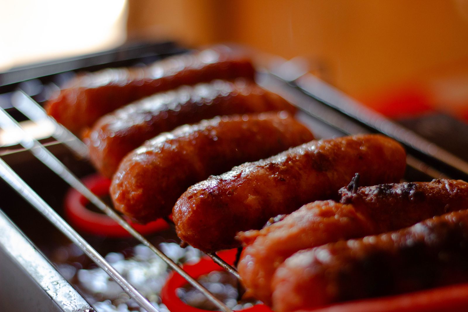 Juicy grilled sausages on a hot barbecue