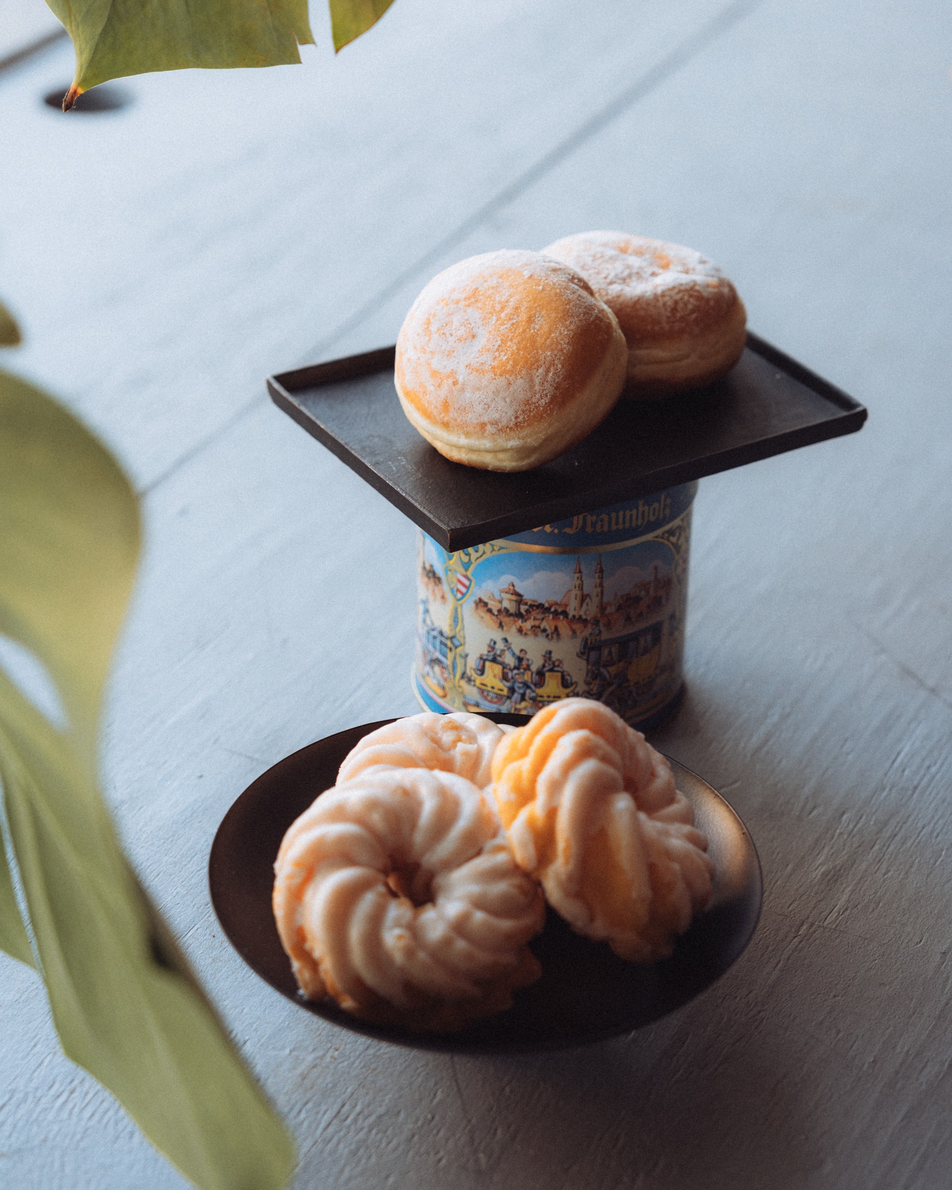 Assorted German pastries including Berliner on plates