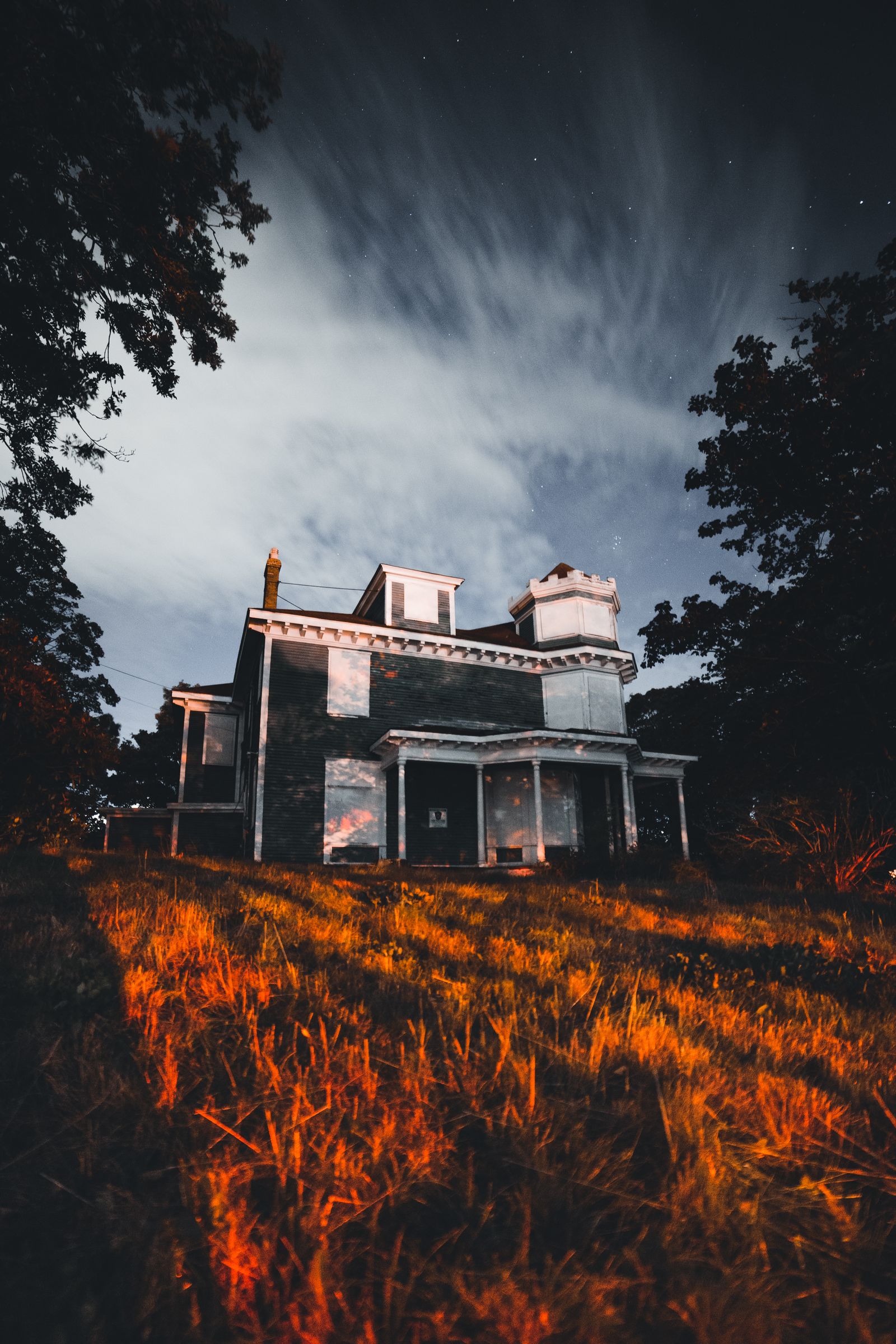 Haunted house at night with eerie lighting