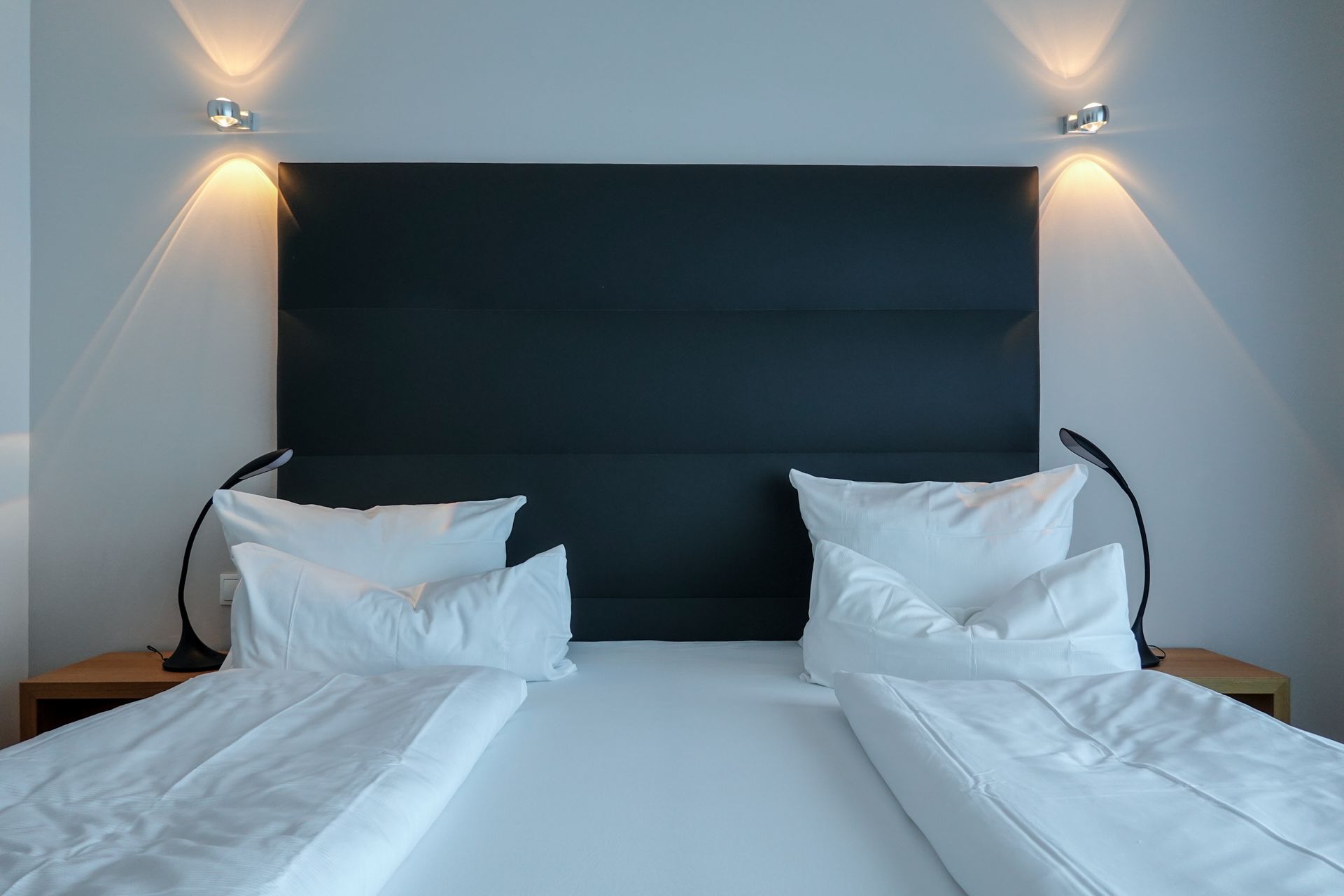 Elegant hotel bedroom with neatly made double bed