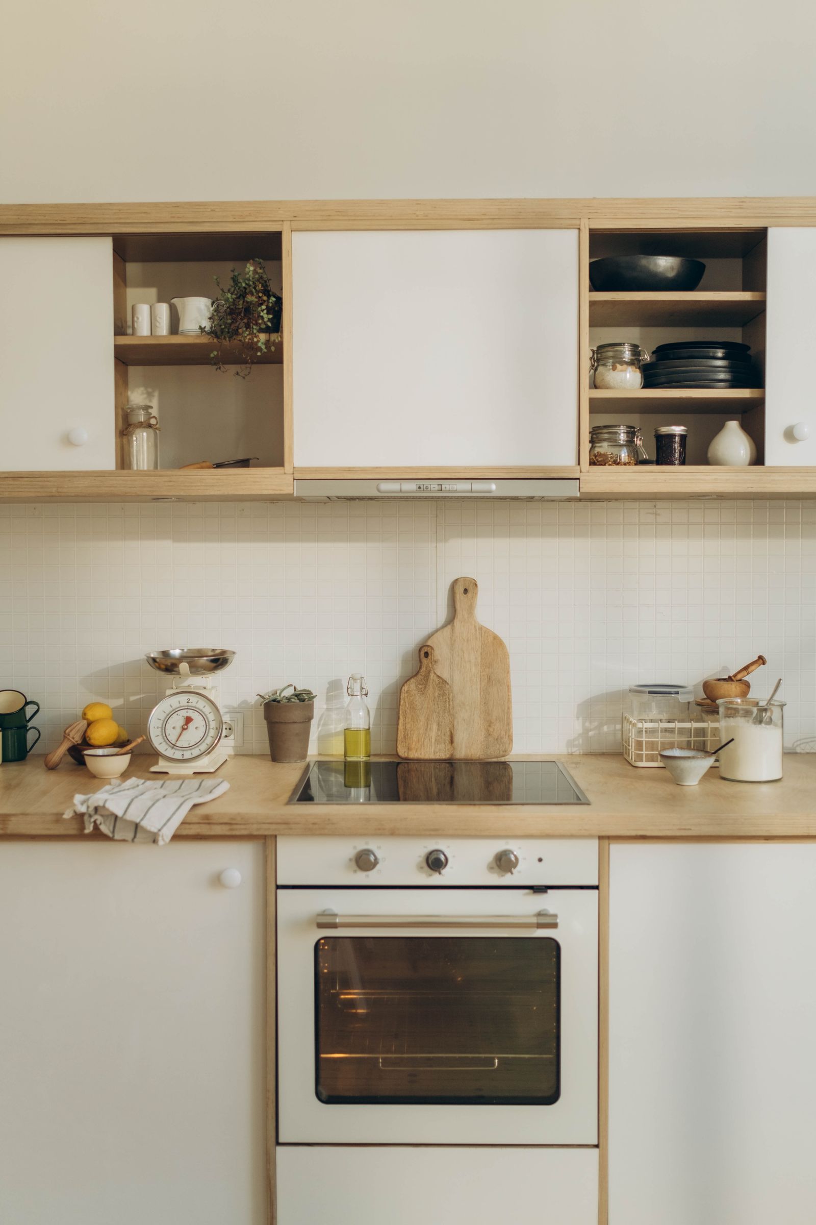 A well-organized modern kitchen featuring wooden cabinets and countertop