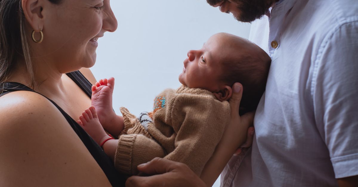 Parents holding their newborn baby