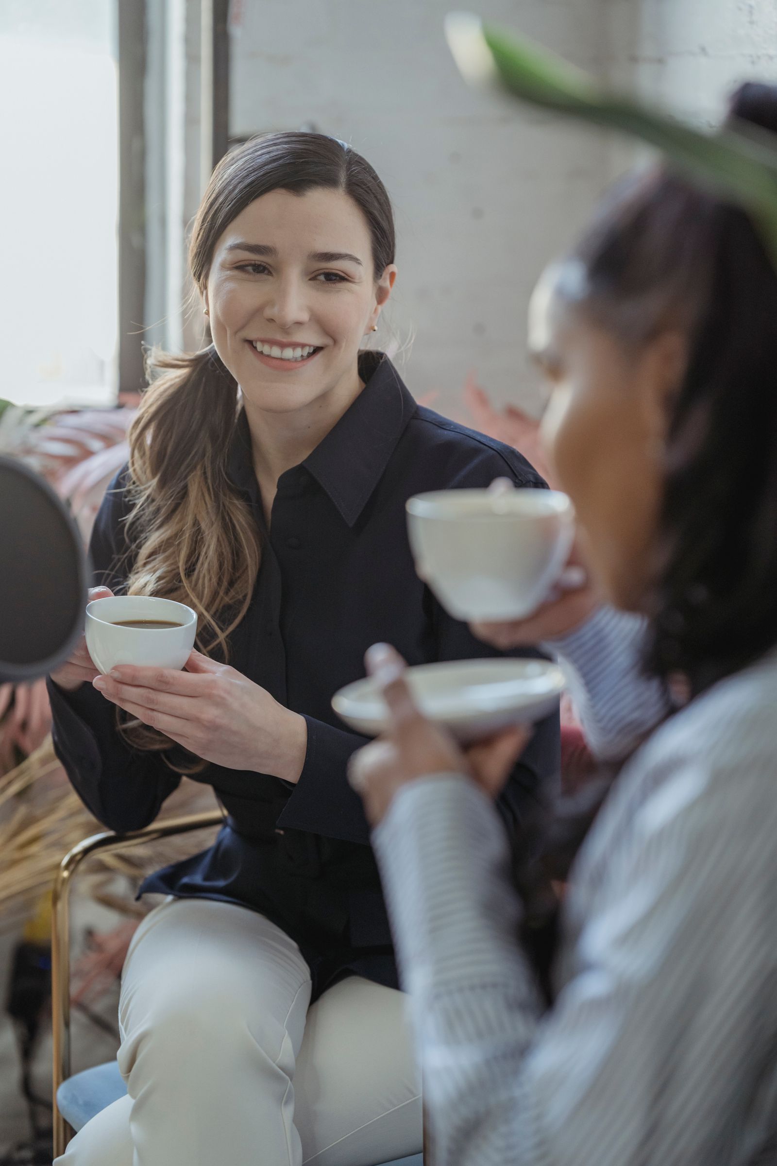 Friends drinking coffee together