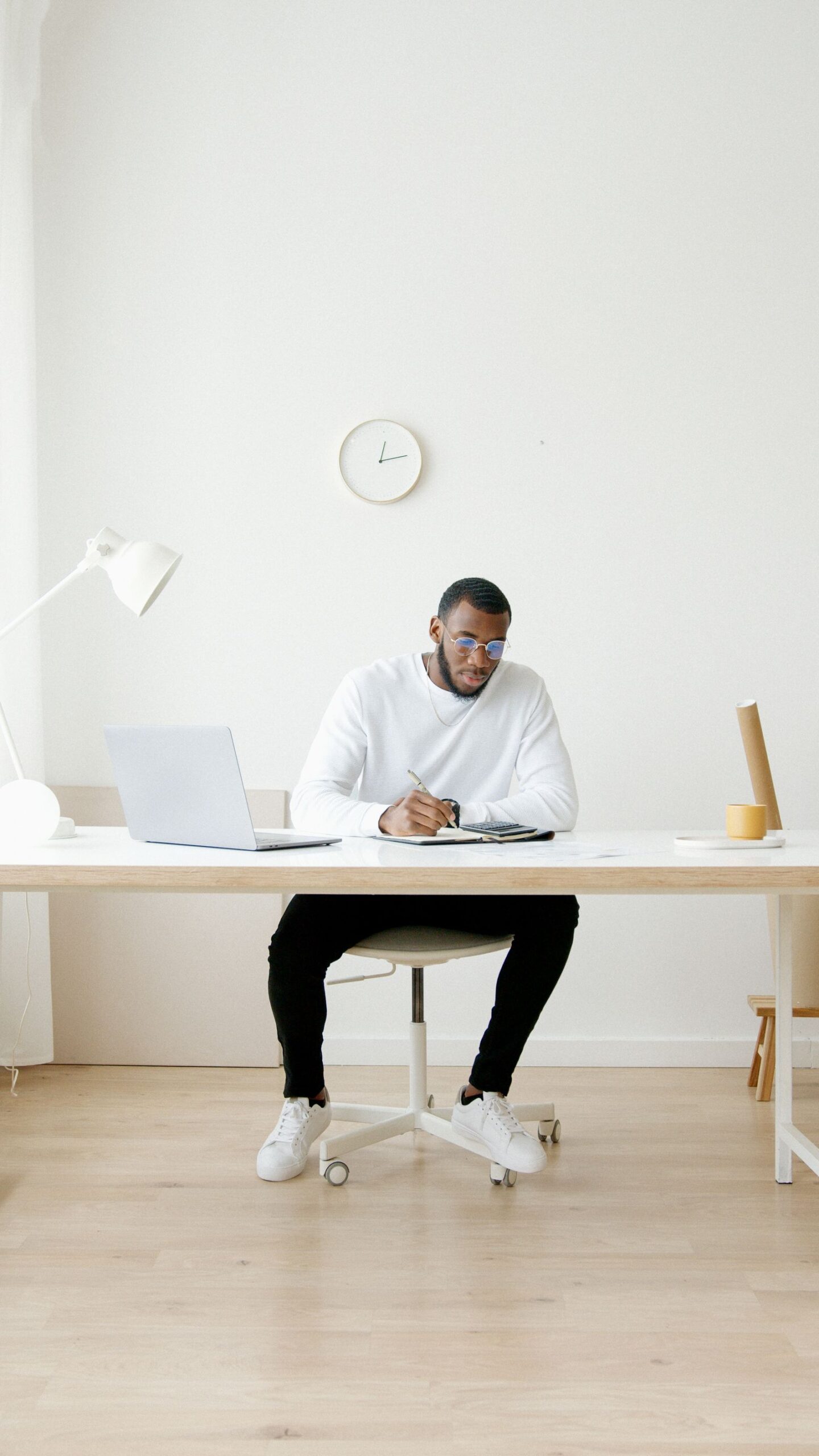 Person working focused at a desk with a laptop