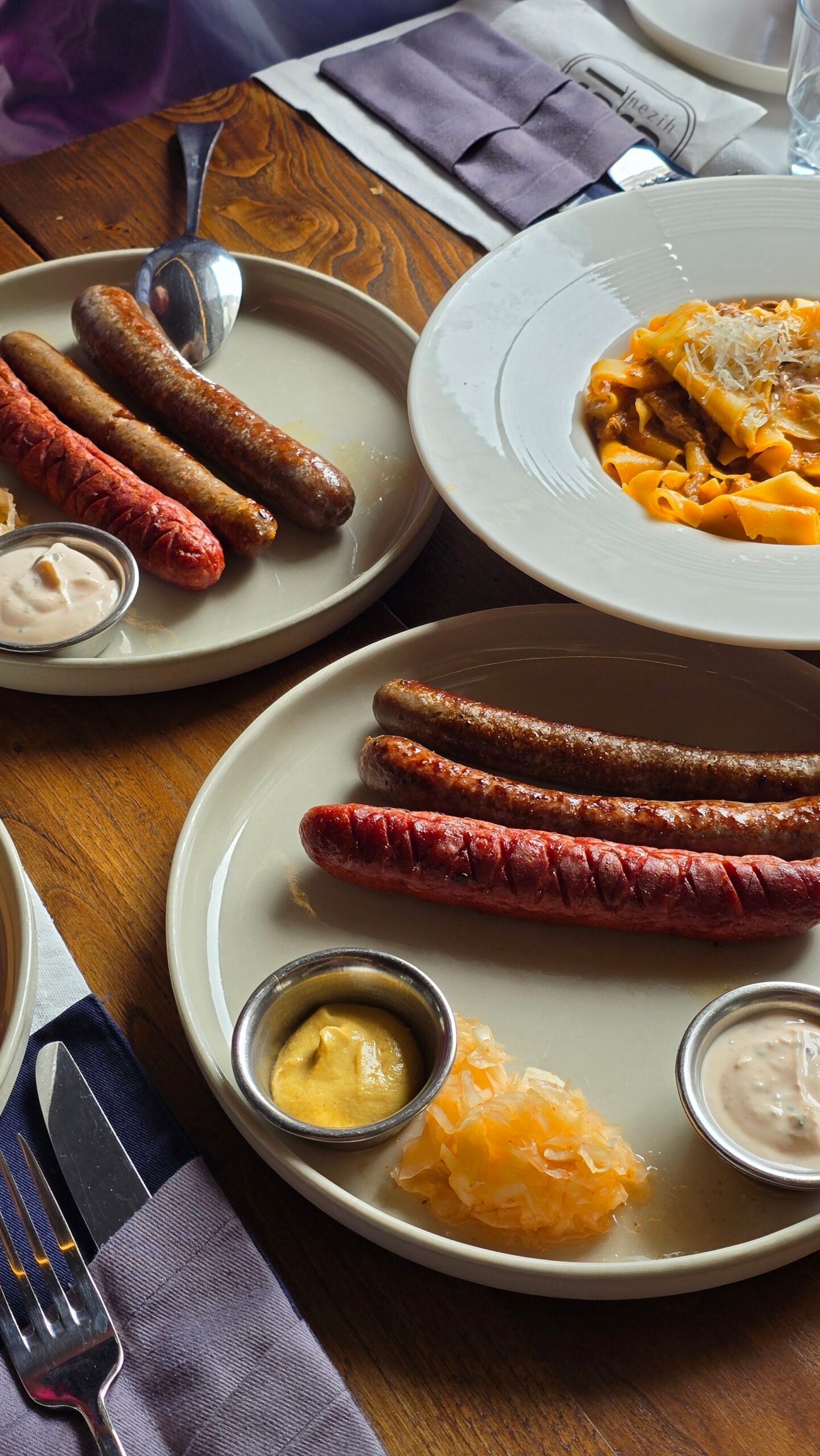 Delicious gourmet sausage platter served with sauerkraut and mustard