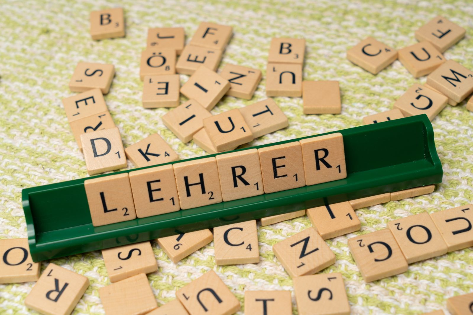 Wooden letter tiles spelling the German word Lehrer