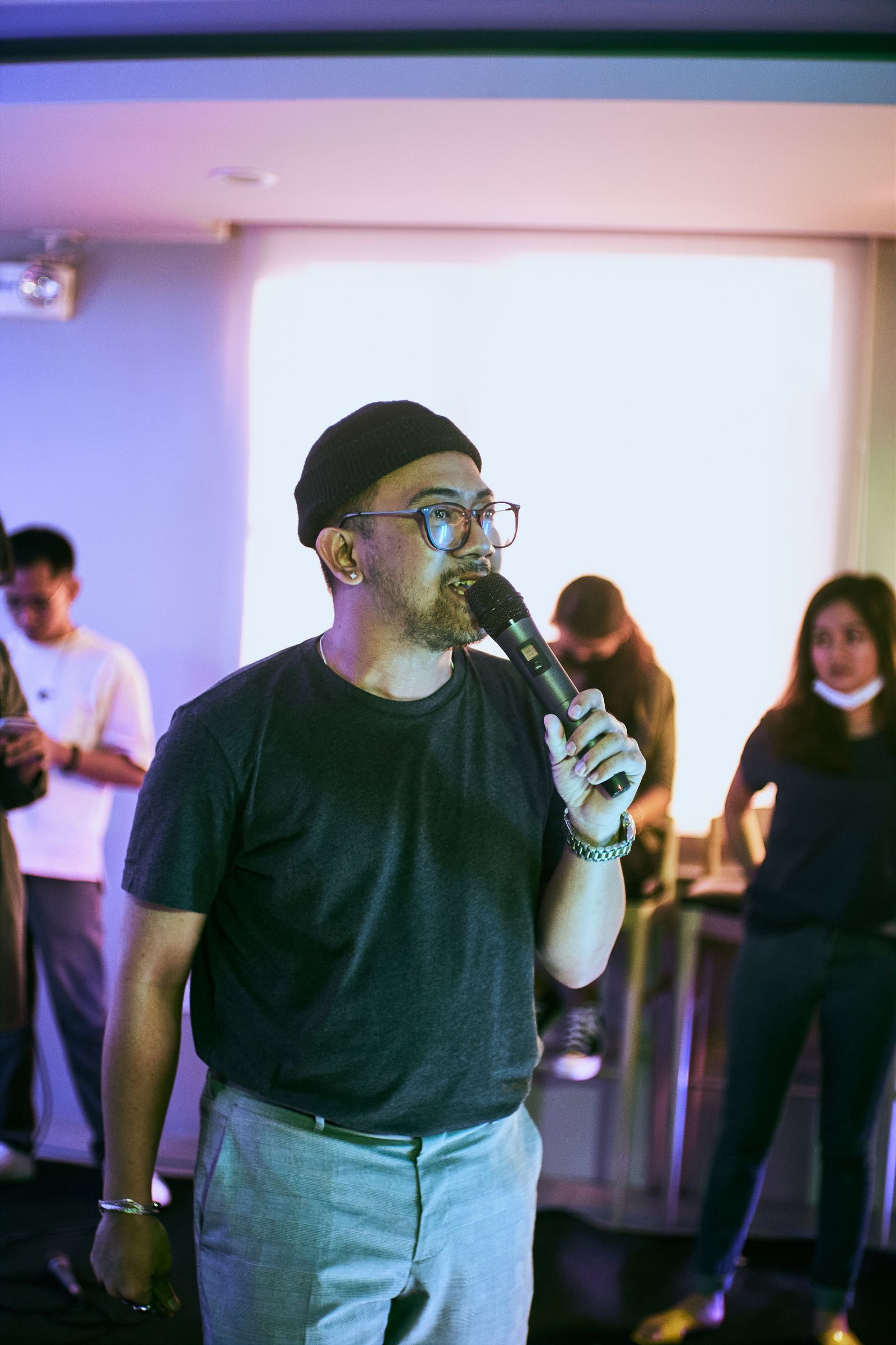 Person speaking into a microphone