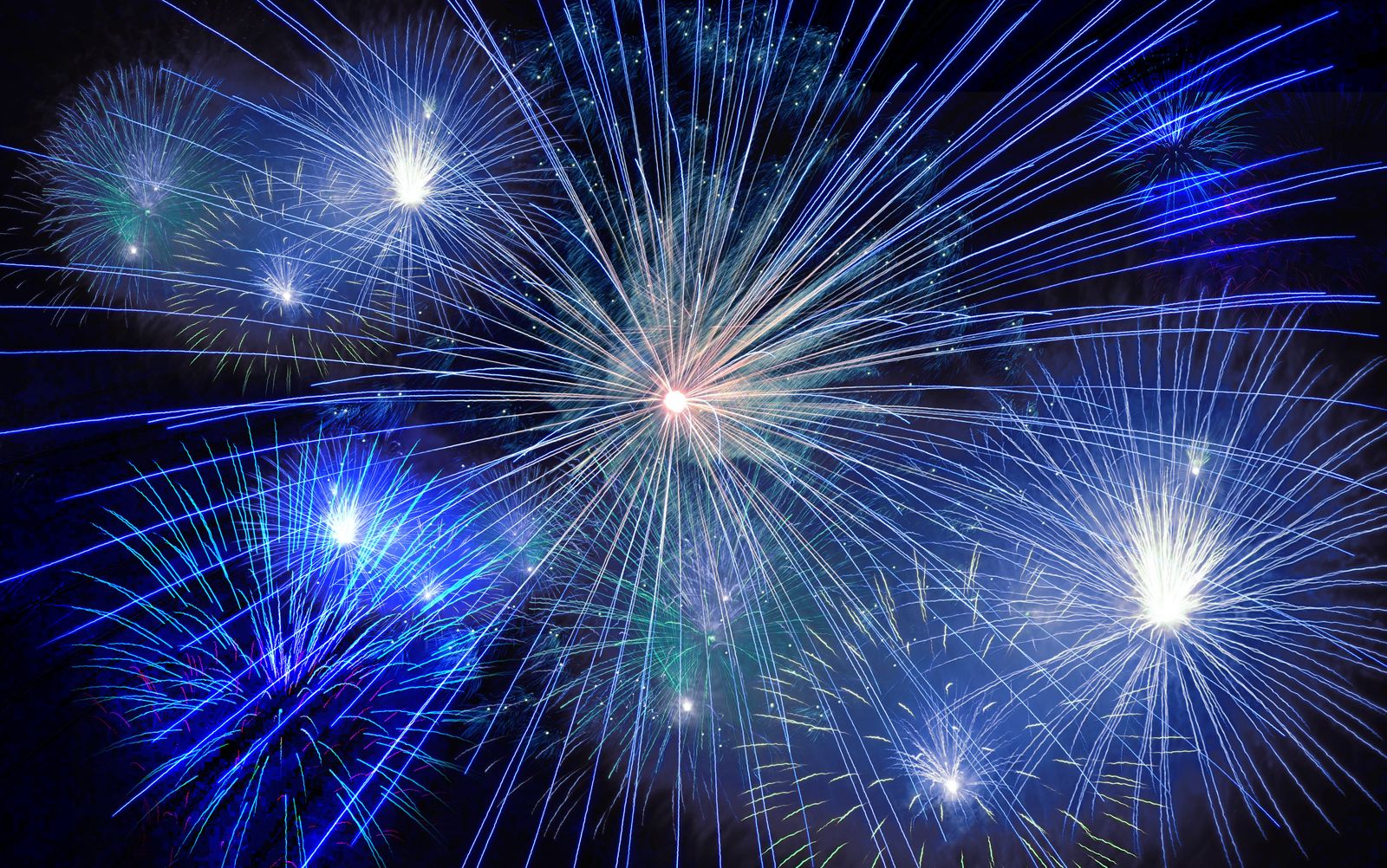 Colorful fireworks exploding in the night sky in a timelapse shot