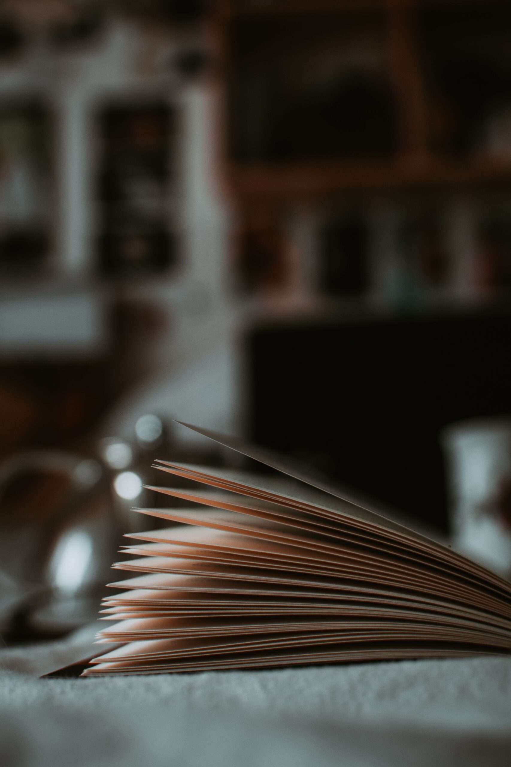 Open book with pages in focus in cozy light