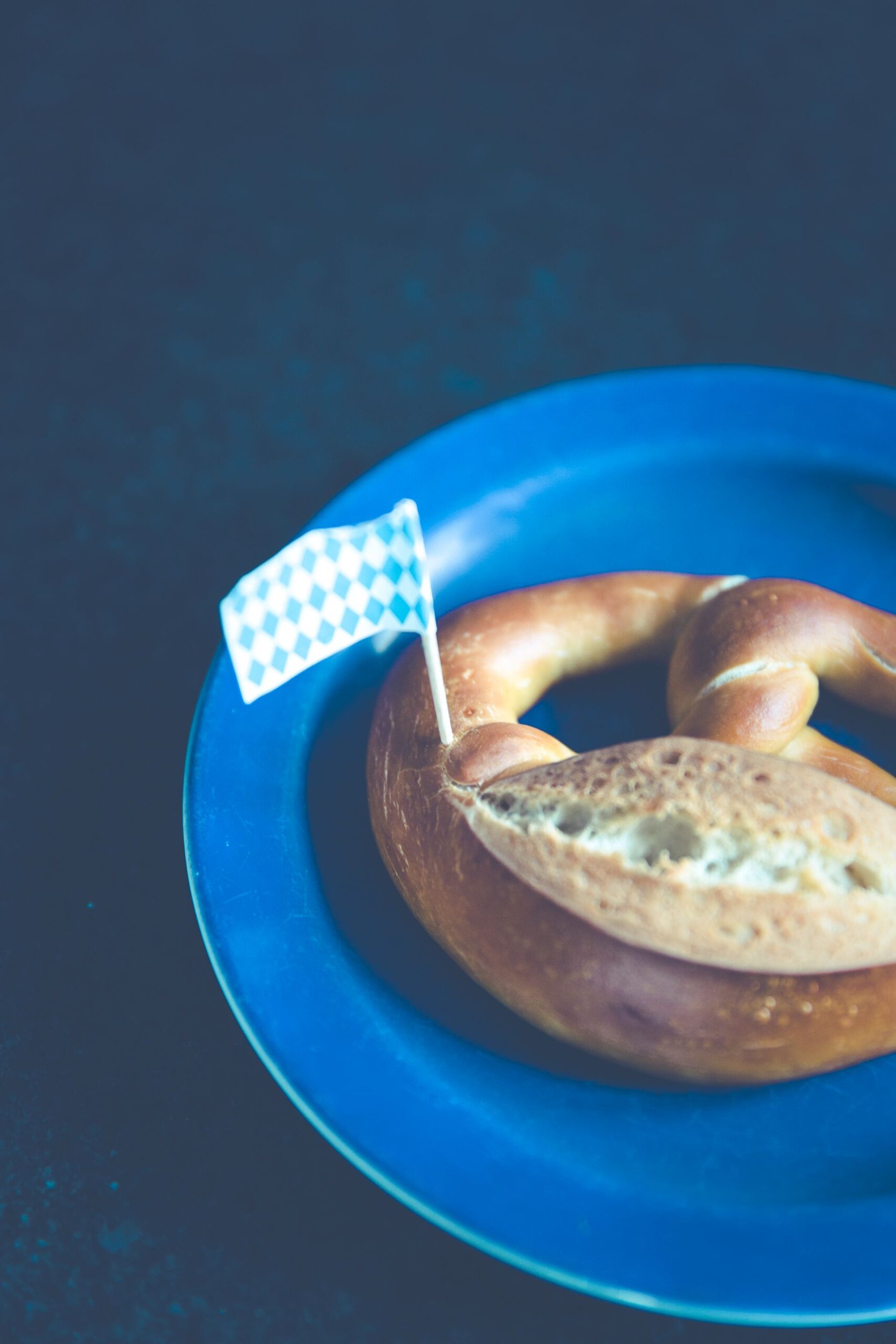 Classic Bavarian pretzel on a blue plate